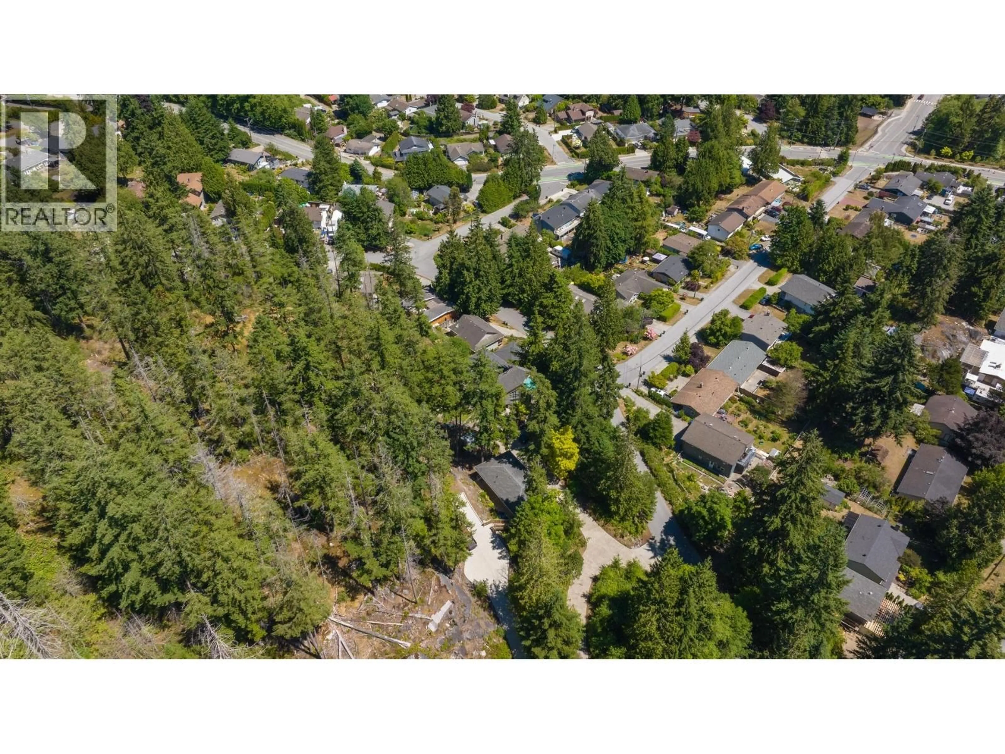 A pic from outside/outdoor area/front of a property/back of a property/a pic from drone, forest/trees view for 5673 SALMON DRIVE, Sechelt British Columbia V0N3A0