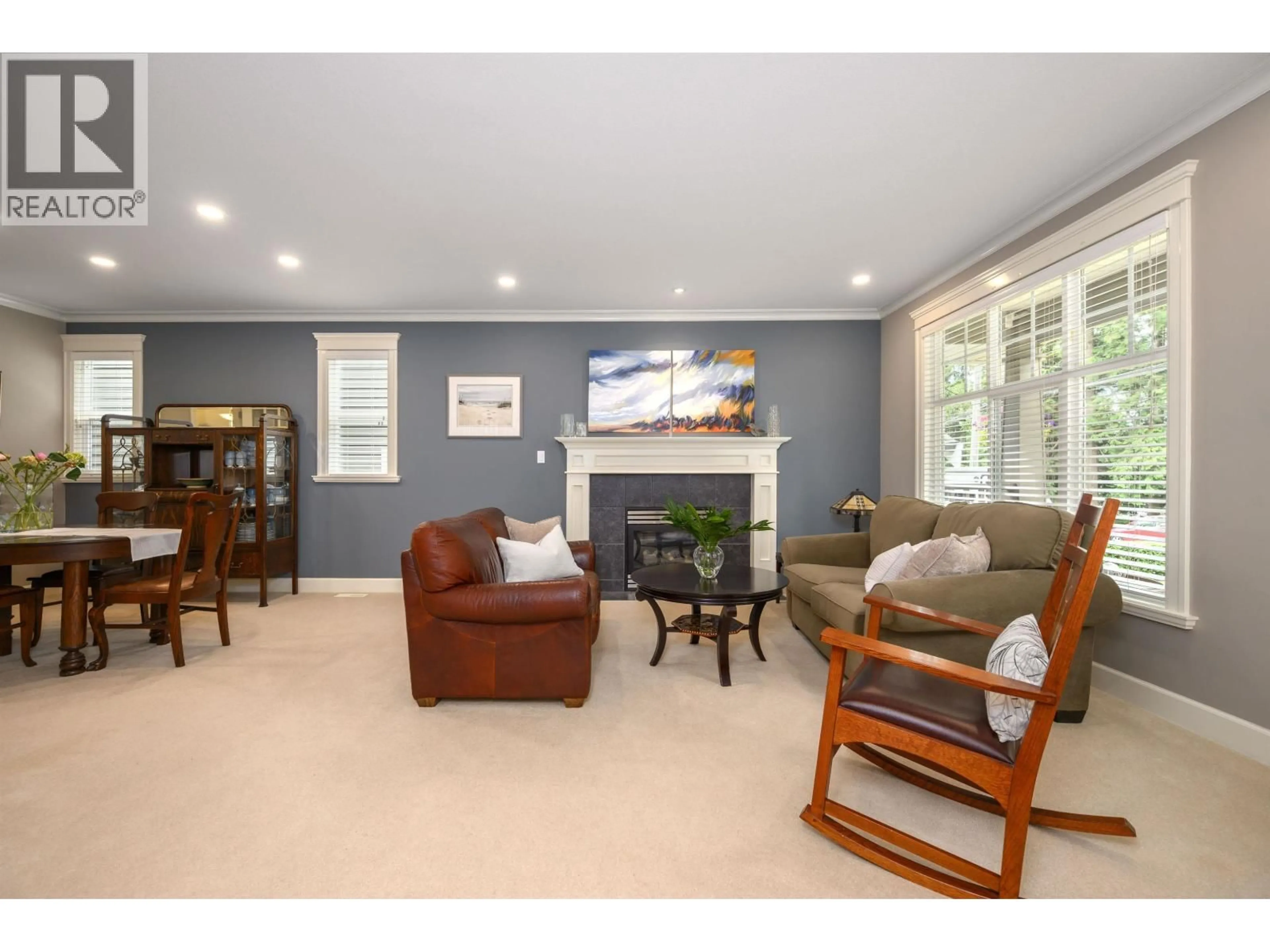 Living room with furniture, wood/laminate floor for 4532 RAMSAY ROAD, North Vancouver British Columbia V7K2N5
