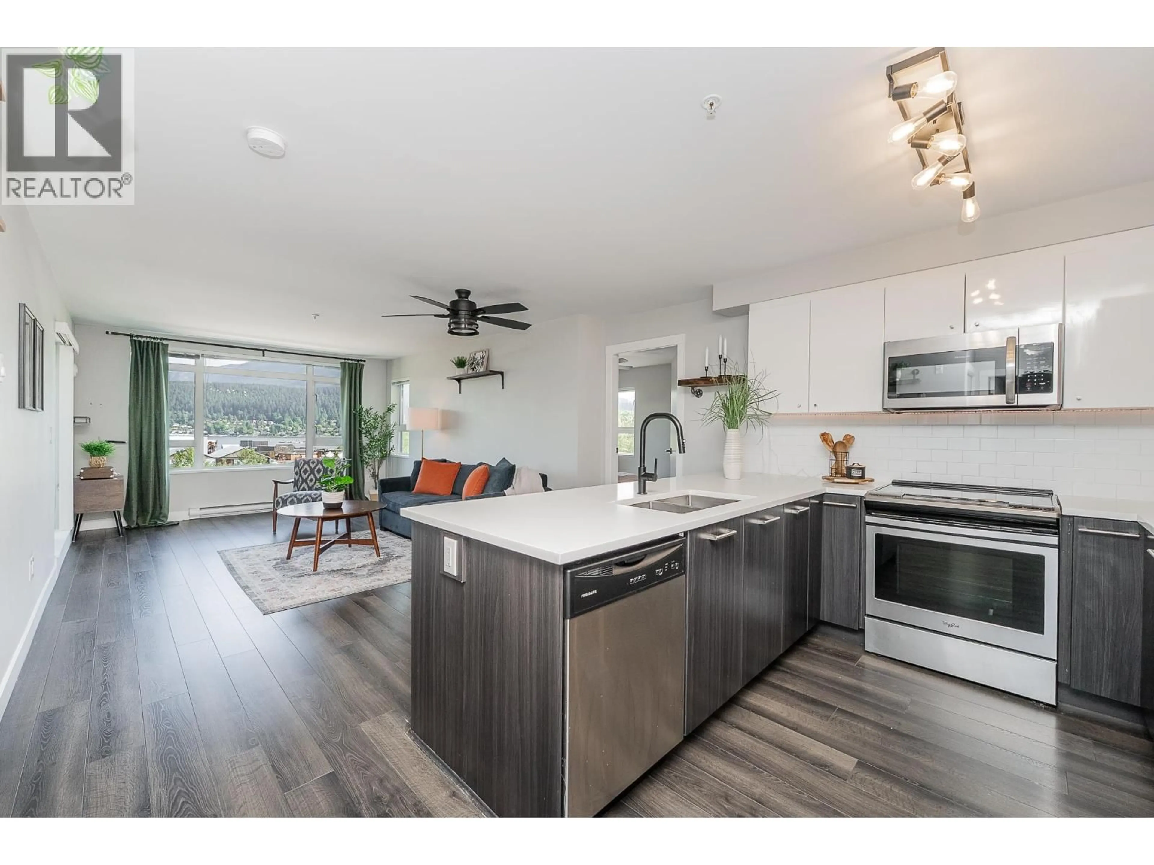 Open concept kitchen, wood/laminate floor for 414 - 2525 CLARKE STREET, Port Moody British Columbia V3H0J3