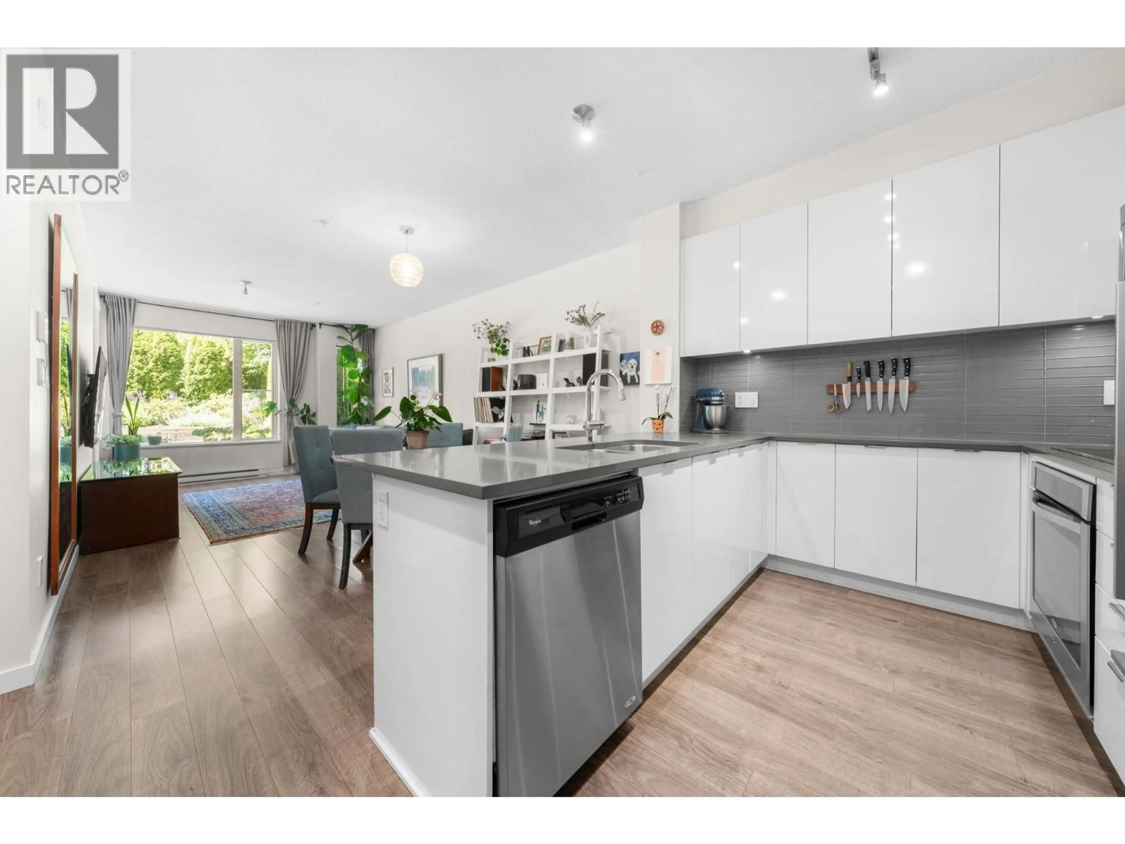 Open concept kitchen, wood/laminate floor for 108 - 2665 MOUNTAIN HIGHWAY, North Vancouver British Columbia V7J0A8