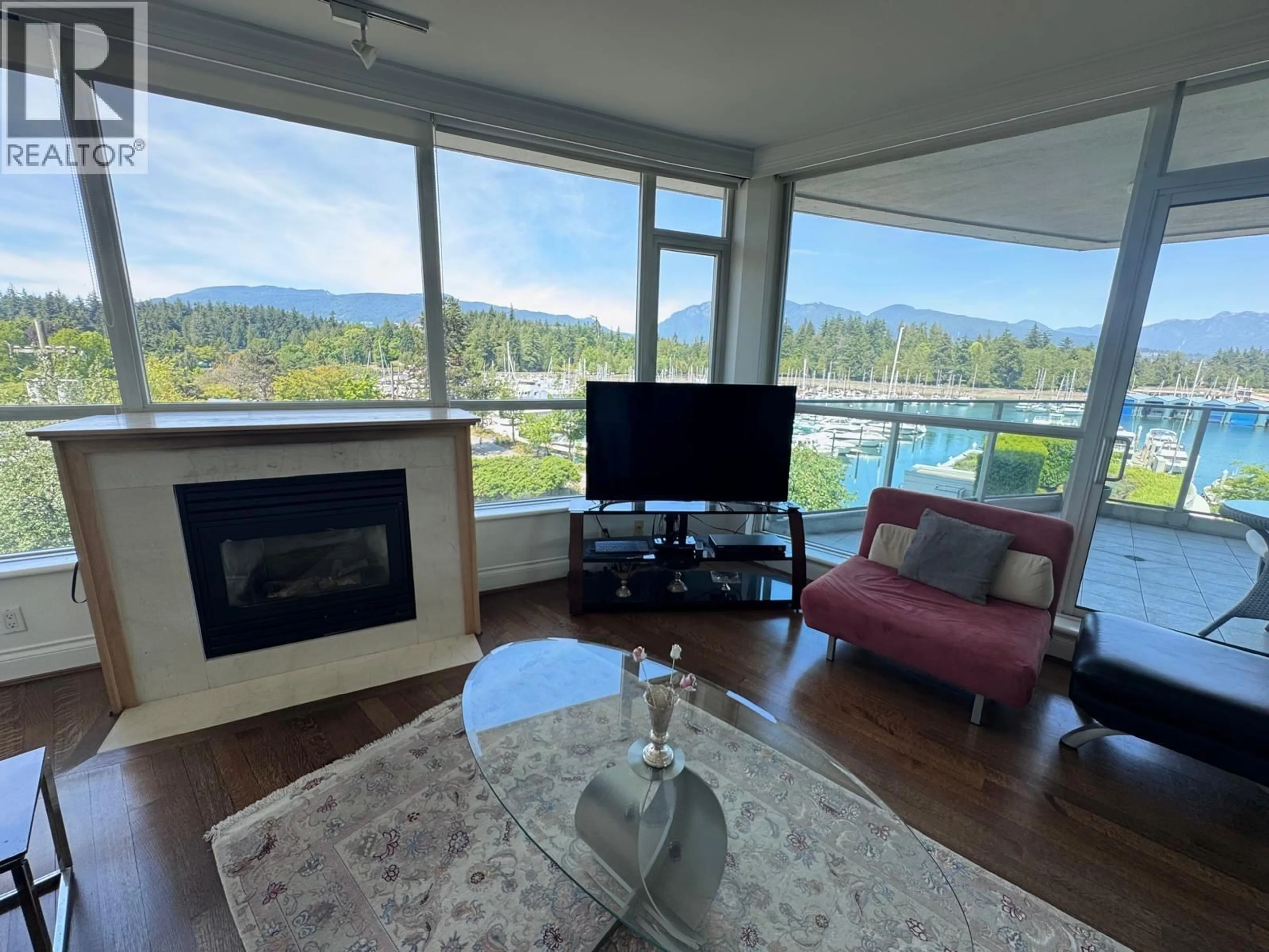Living room with furniture, wood/laminate floor for 402 - 1777 BAYSHORE DRIVE, Vancouver British Columbia V6G3H2