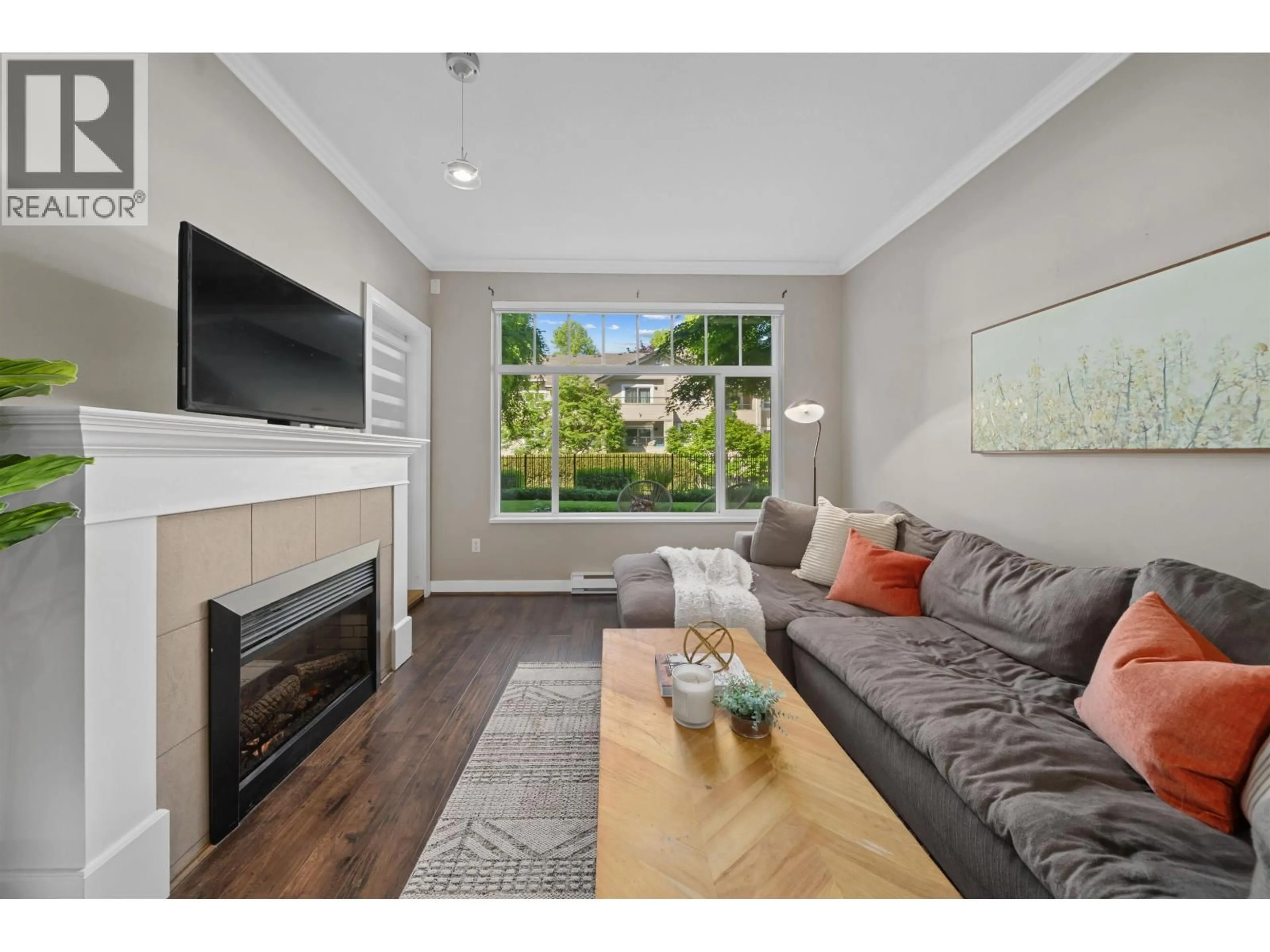Living room with furniture, wood/laminate floor for 116 - 2353 MARPOLE AVENUE, Port Coquitlam British Columbia V3S2A1