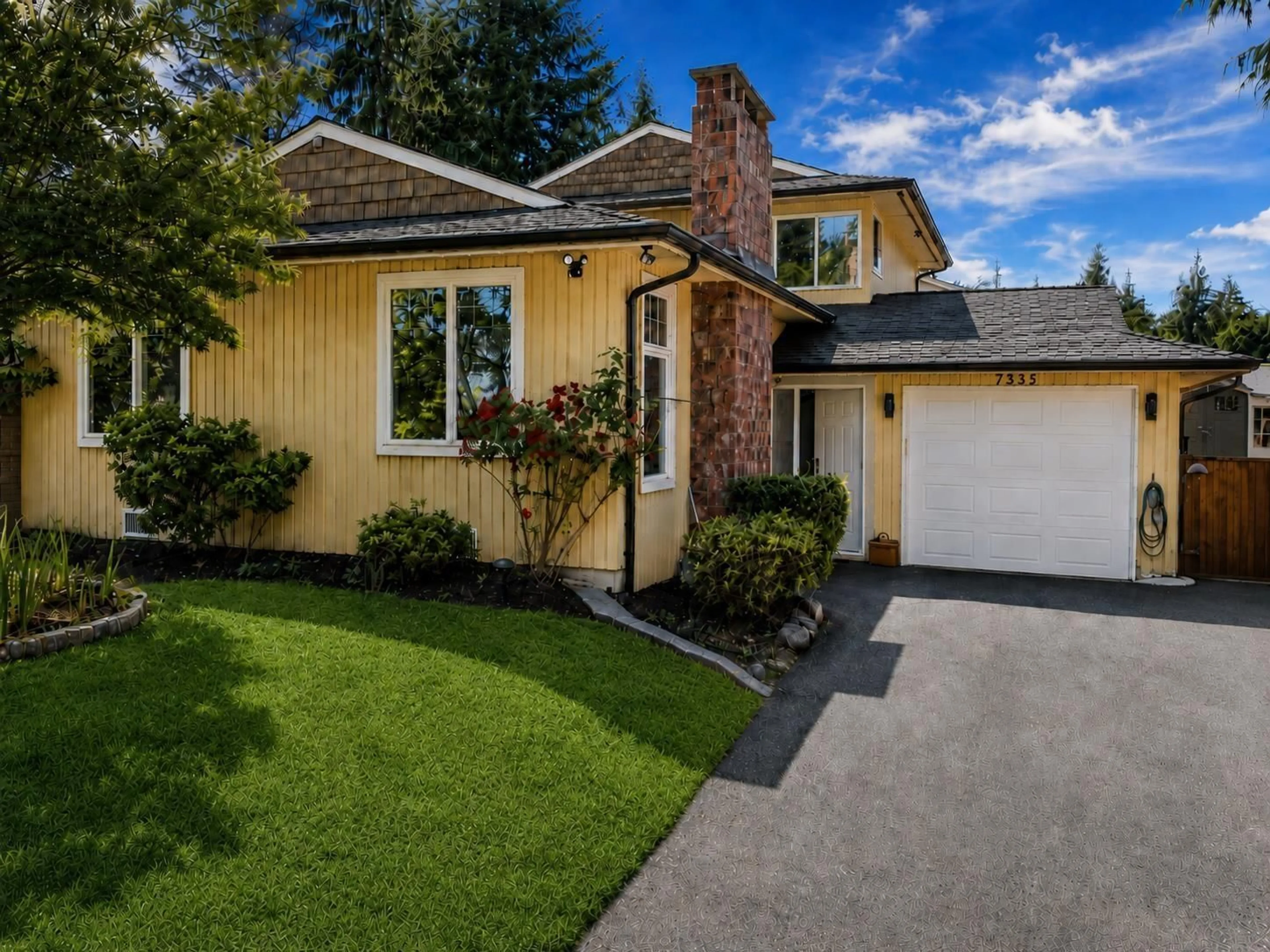 Home with vinyl exterior material, street for 7335 141A STREET, Surrey British Columbia V3W7L2