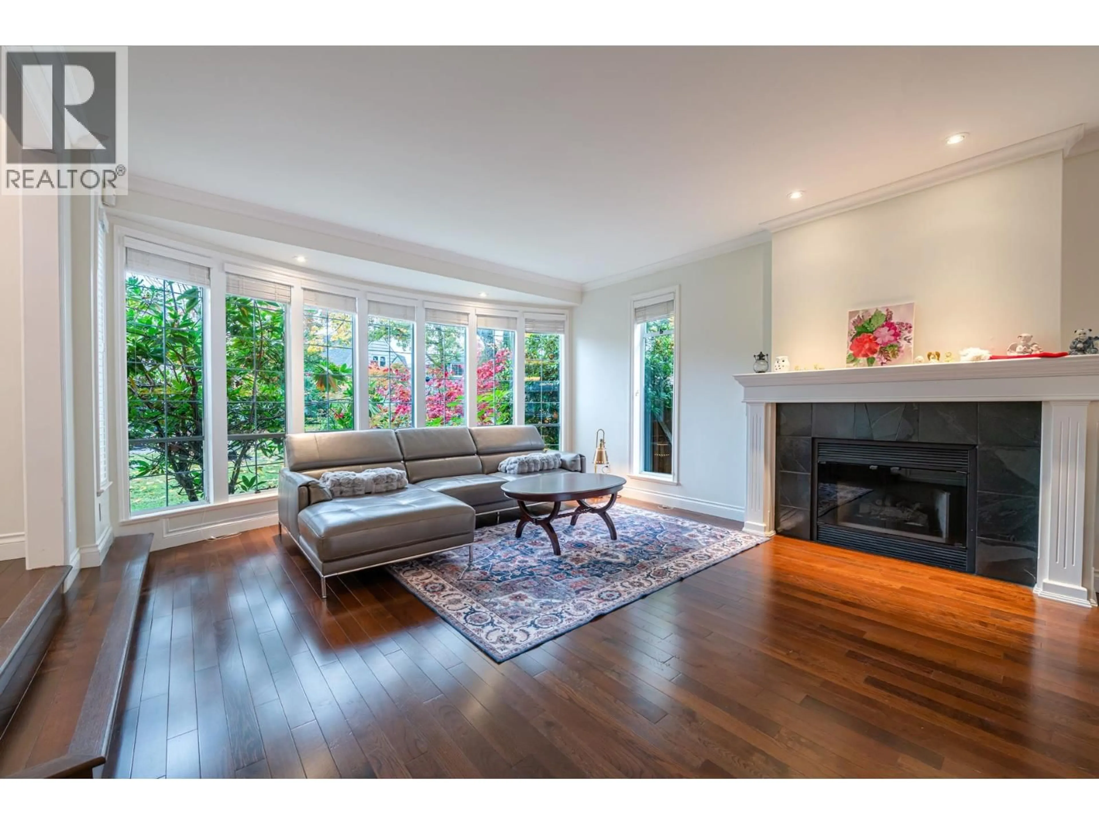 Living room with furniture, wood/laminate floor for 4570 13TH AVENUE, Vancouver British Columbia V6R2V4