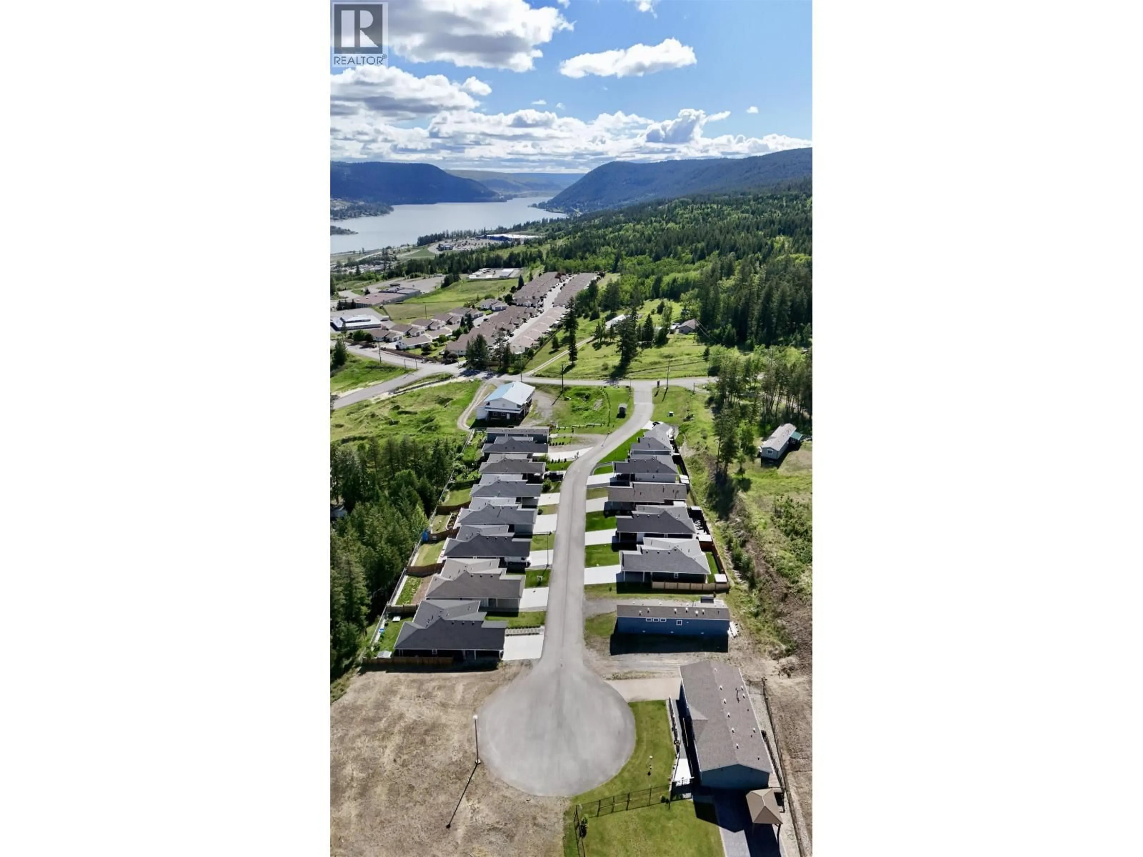 A pic from outside/outdoor area/front of a property/back of a property/a pic from drone, mountain view for 16 - 555 WOTZKE DRIVE, Williams Lake British Columbia V2G4K2