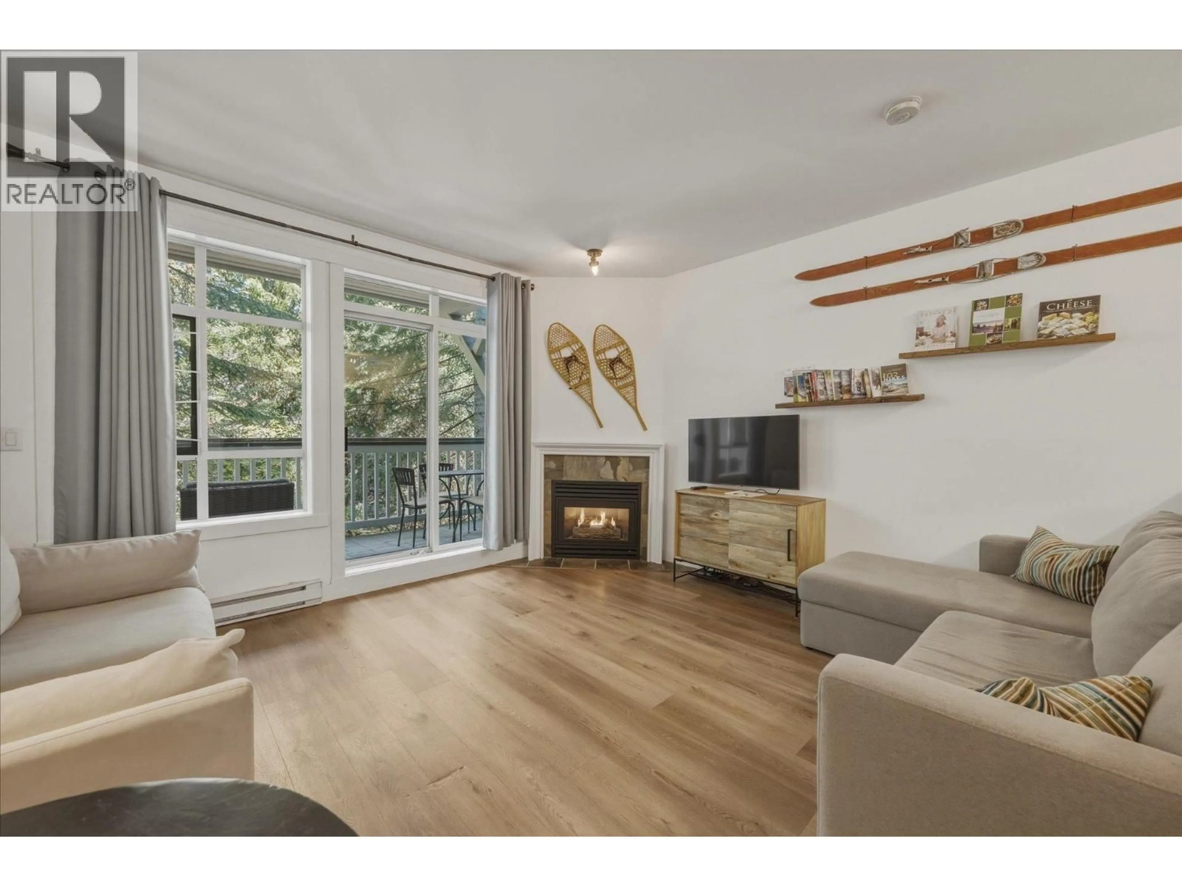 Living room with furniture, wood/laminate floor for 308 - 4405 BLACKCOMB WAY, Whistler British Columbia V8E0X7