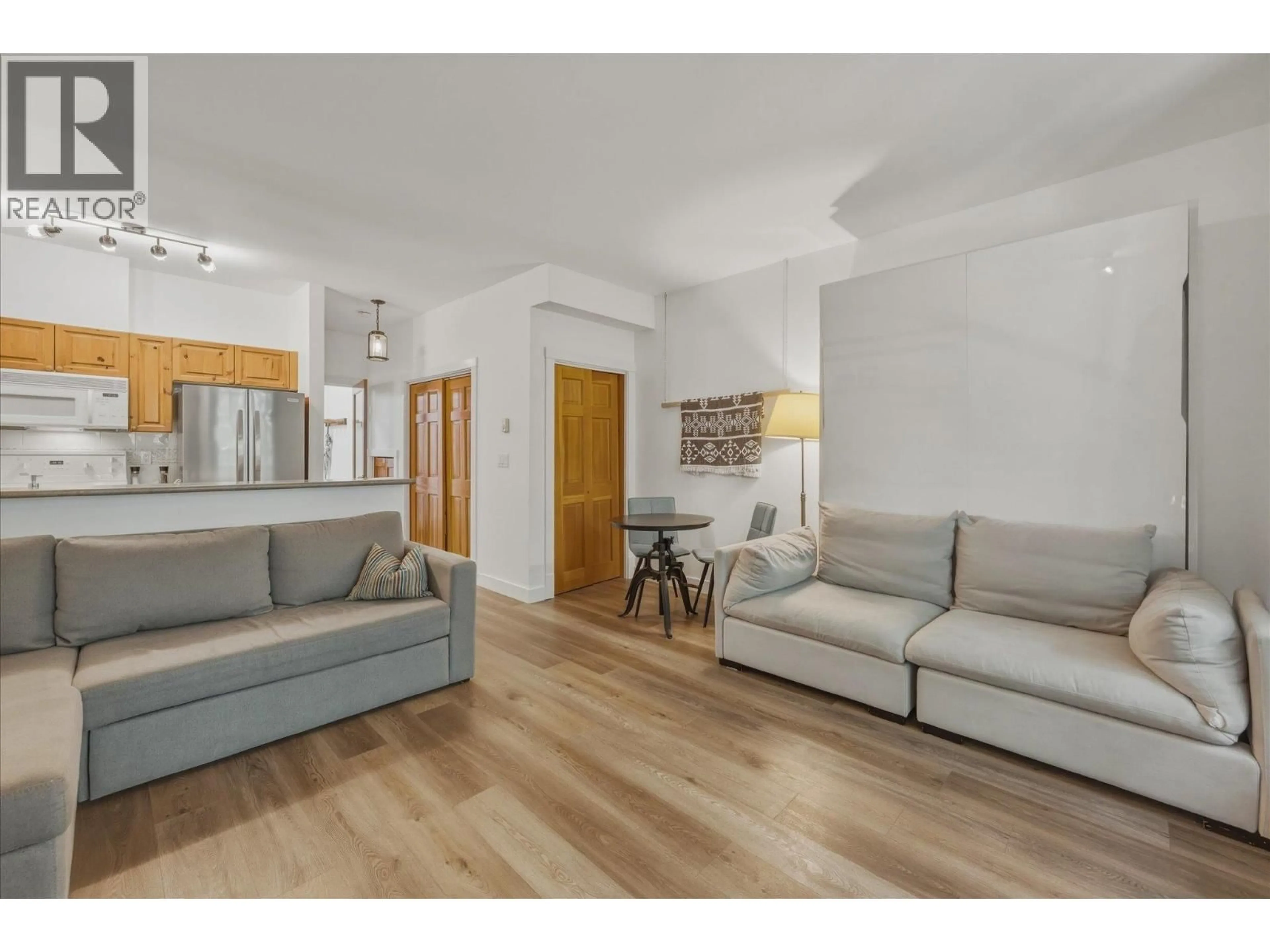 Living room with furniture, wood/laminate floor for 308 - 4405 BLACKCOMB WAY, Whistler British Columbia V8E0X7