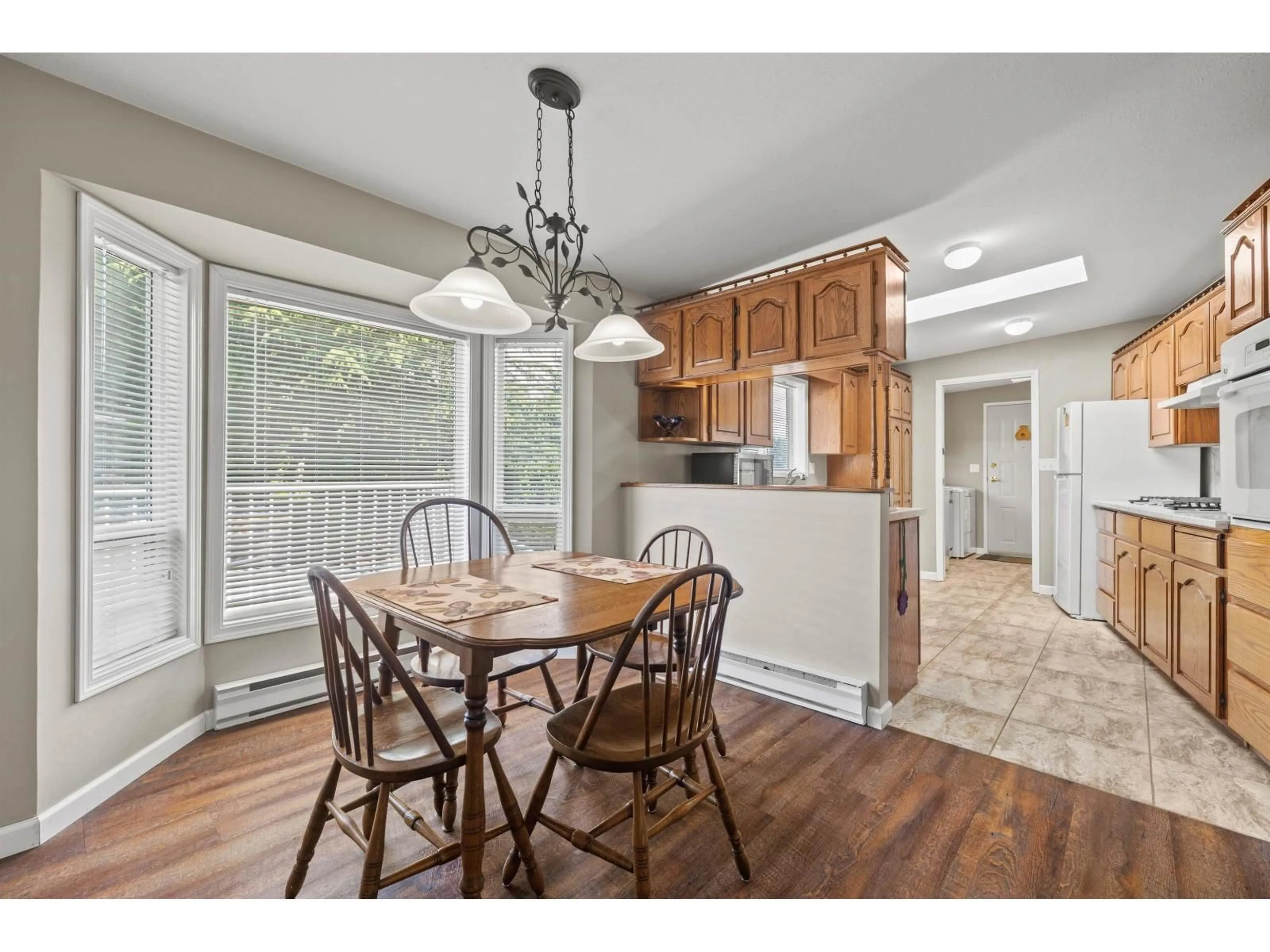 Open concept kitchen, wood/laminate floor for 260 - 27111 0 AVENUE, Langley British Columbia V4W2T6