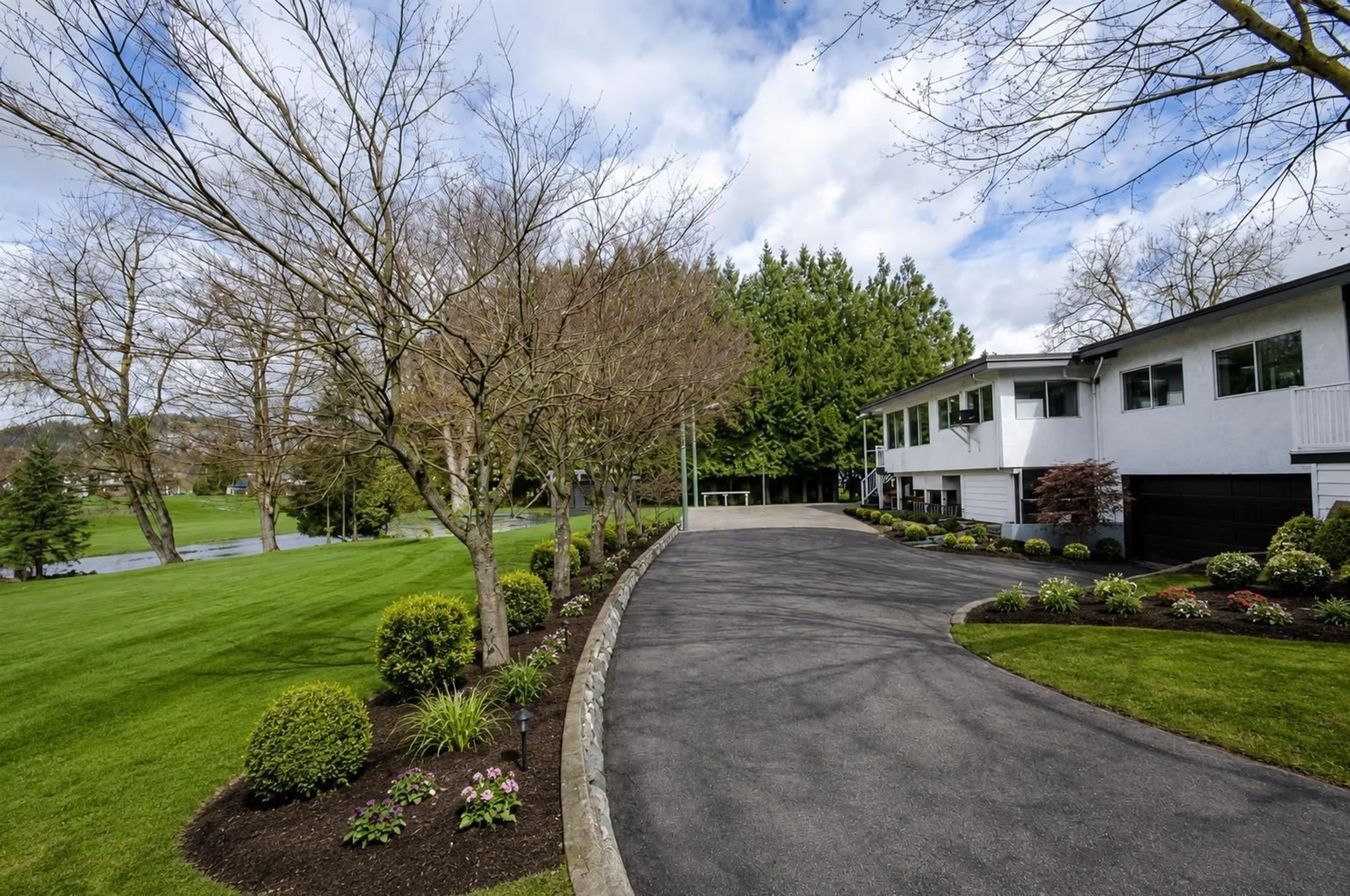 A pic from outside/outdoor area/front of a property/back of a property/a pic from drone, street for 1559 WHATCOM ROAD, Abbotsford British Columbia V3G1Y9