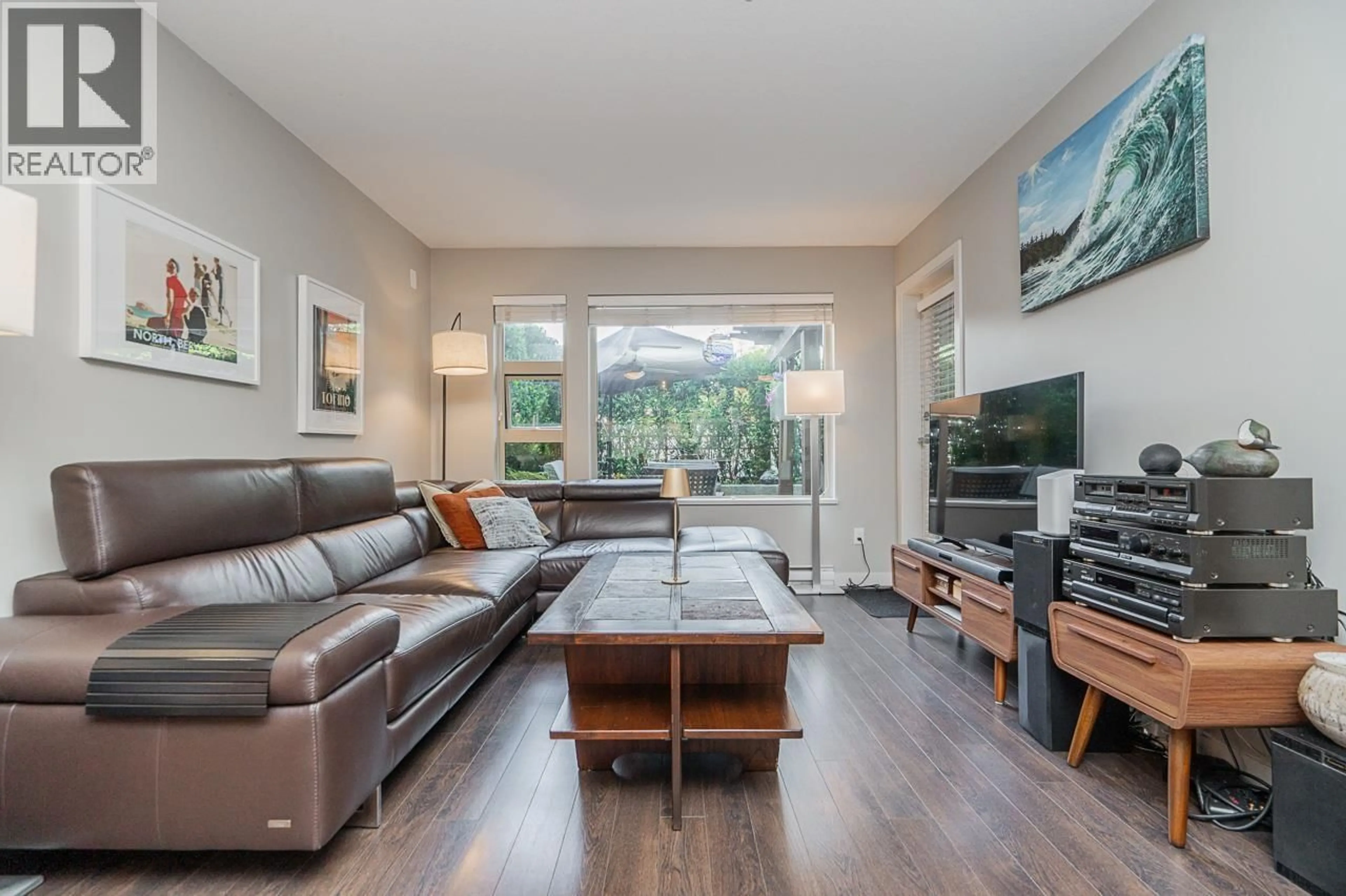 Living room with furniture, wood/laminate floor for 207 - 1677 LLOYD AVENUE, North Vancouver British Columbia V7P0B1