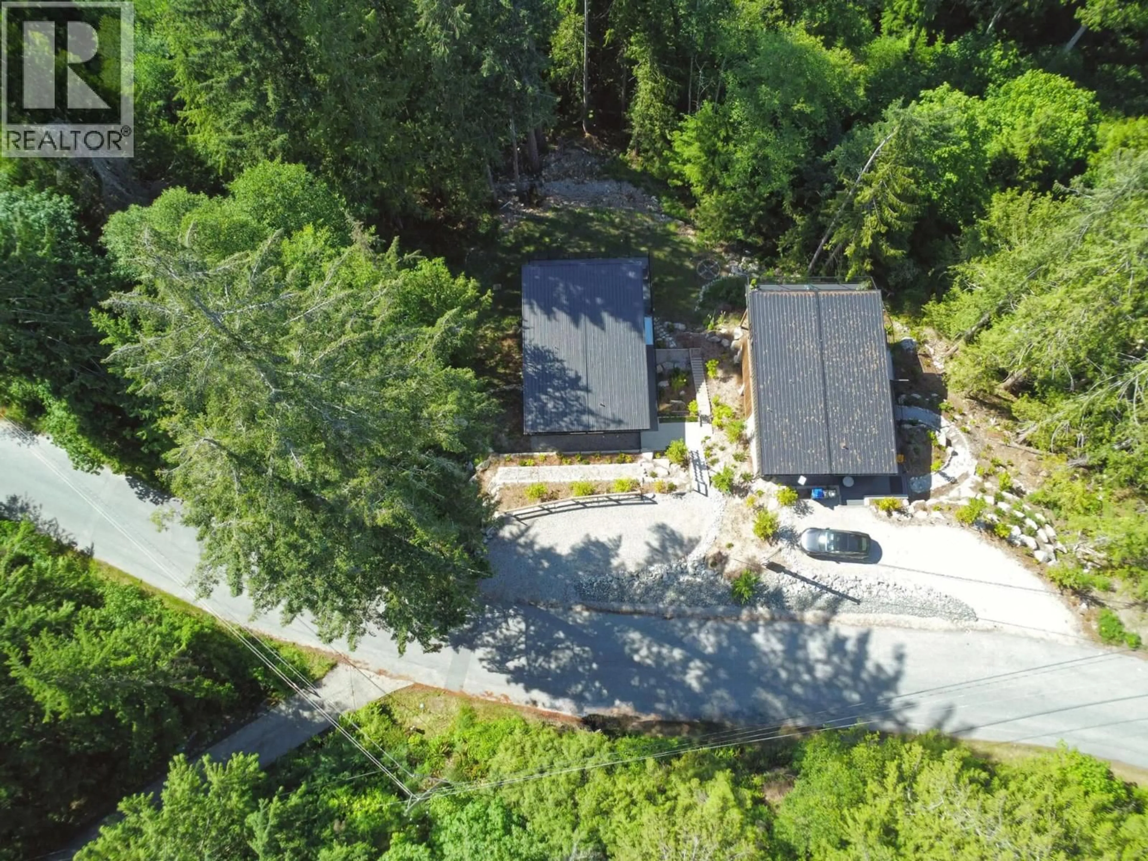 A pic from outside/outdoor area/front of a property/back of a property/a pic from drone, forest/trees view for 5792 TILLICUM BAY ROAD, Sechelt British Columbia V7Z0C7