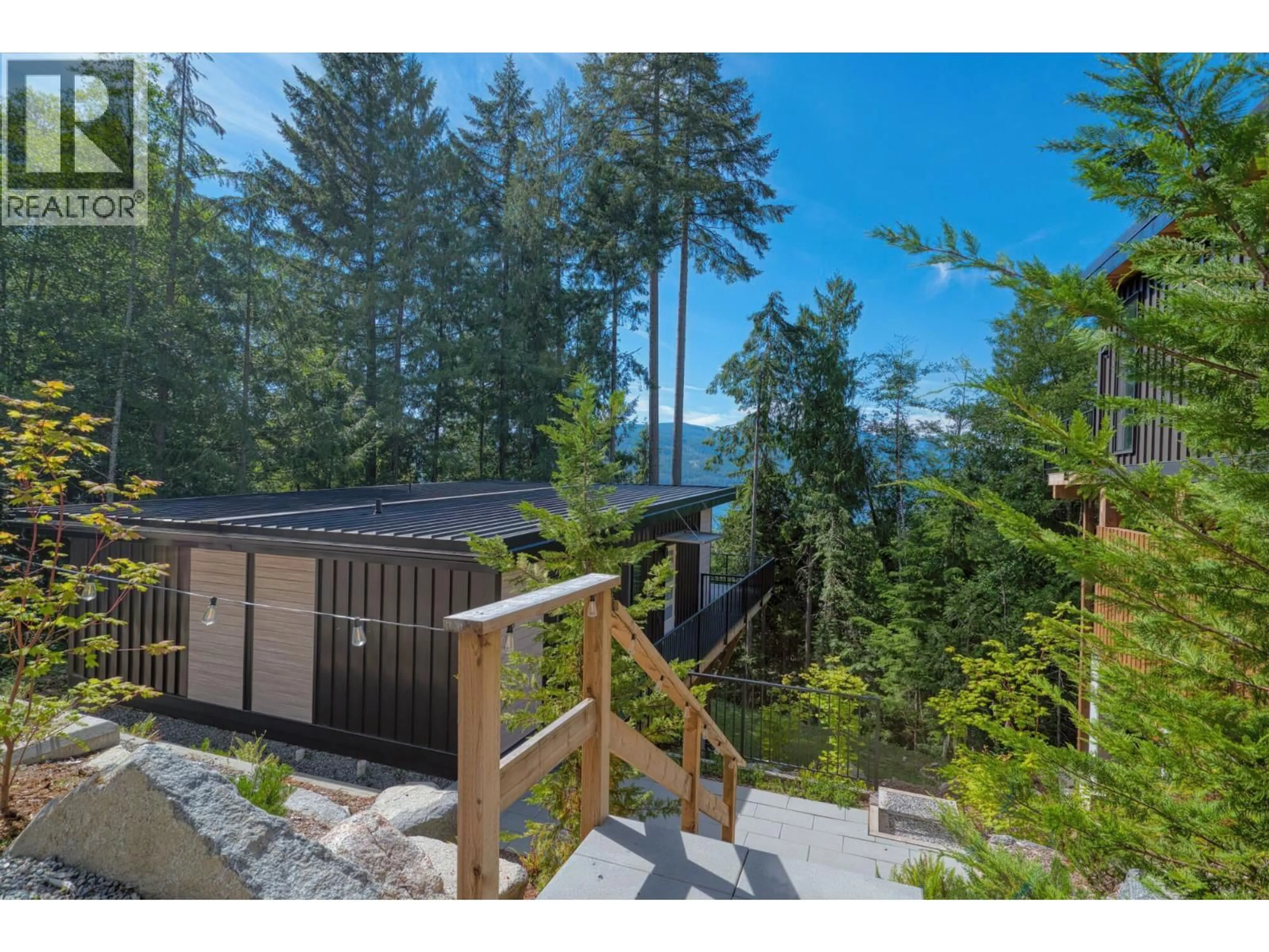 A pic from outside/outdoor area/front of a property/back of a property/a pic from drone, forest/trees view for 5792 TILLICUM BAY ROAD, Sechelt British Columbia V7Z0C7