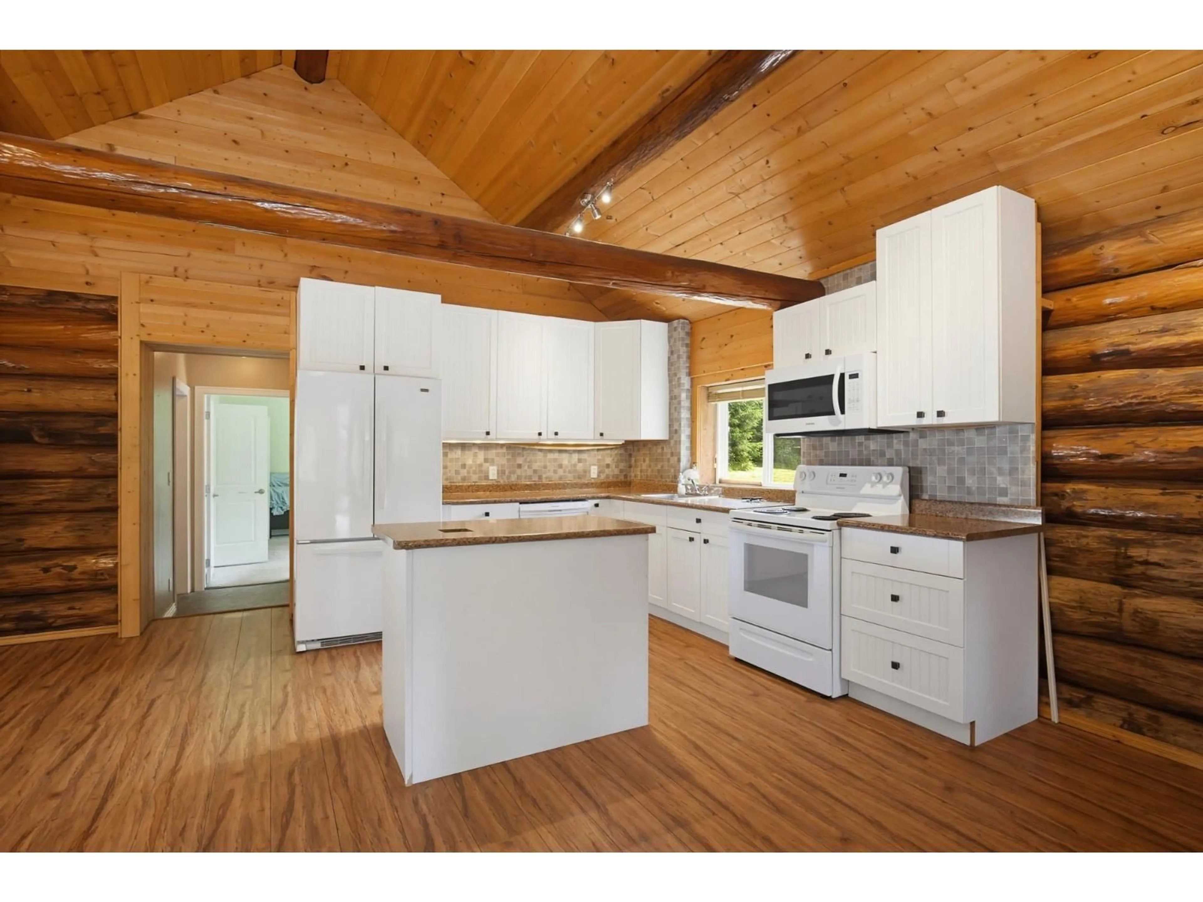Open concept kitchen, wood/laminate floor for 12880 BURNS ROAD, Mission British Columbia V2V4J1