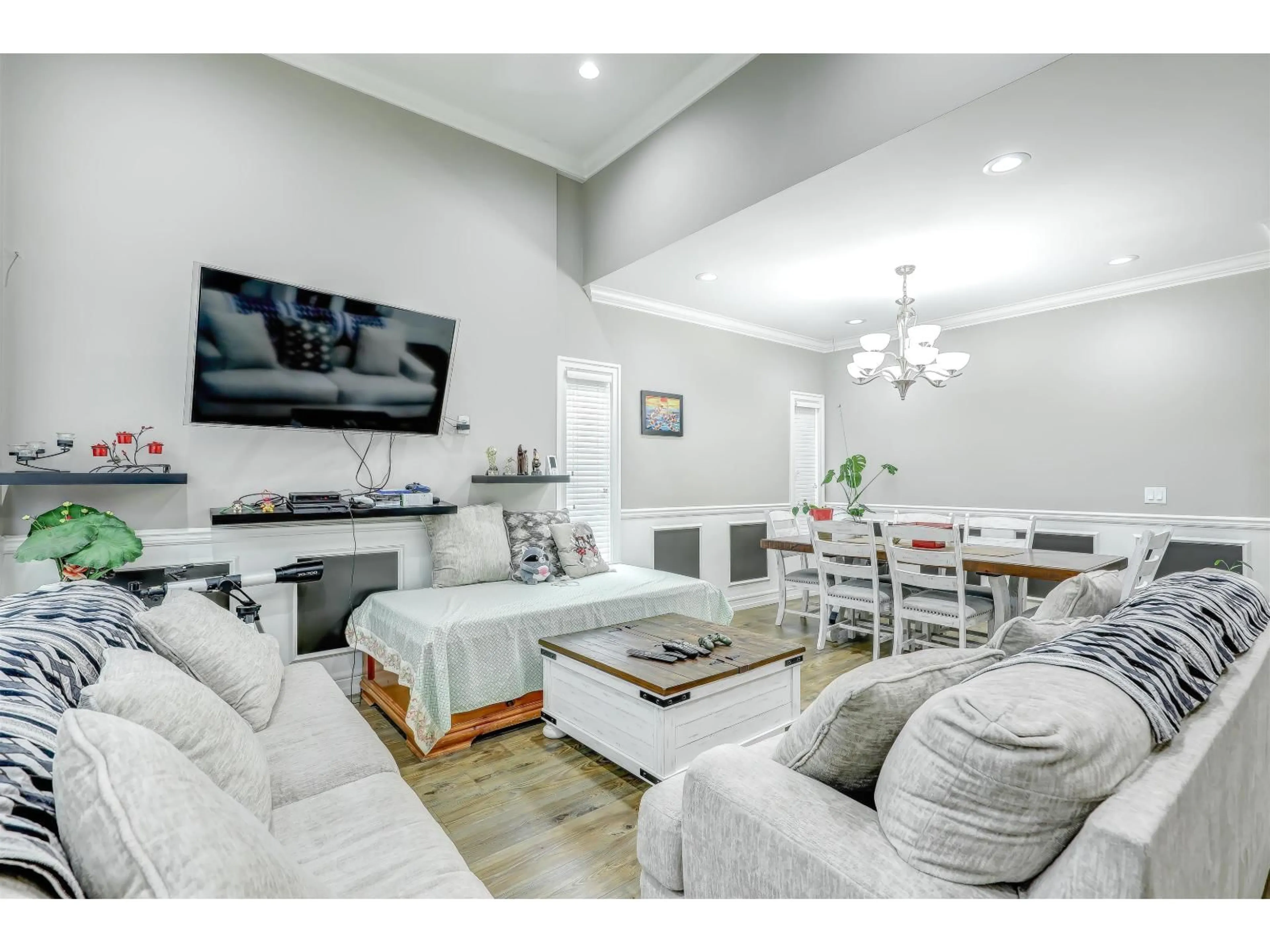 Living room with furniture, wood/laminate floor for 14793 67A AVENUE, Surrey British Columbia V3S4P9