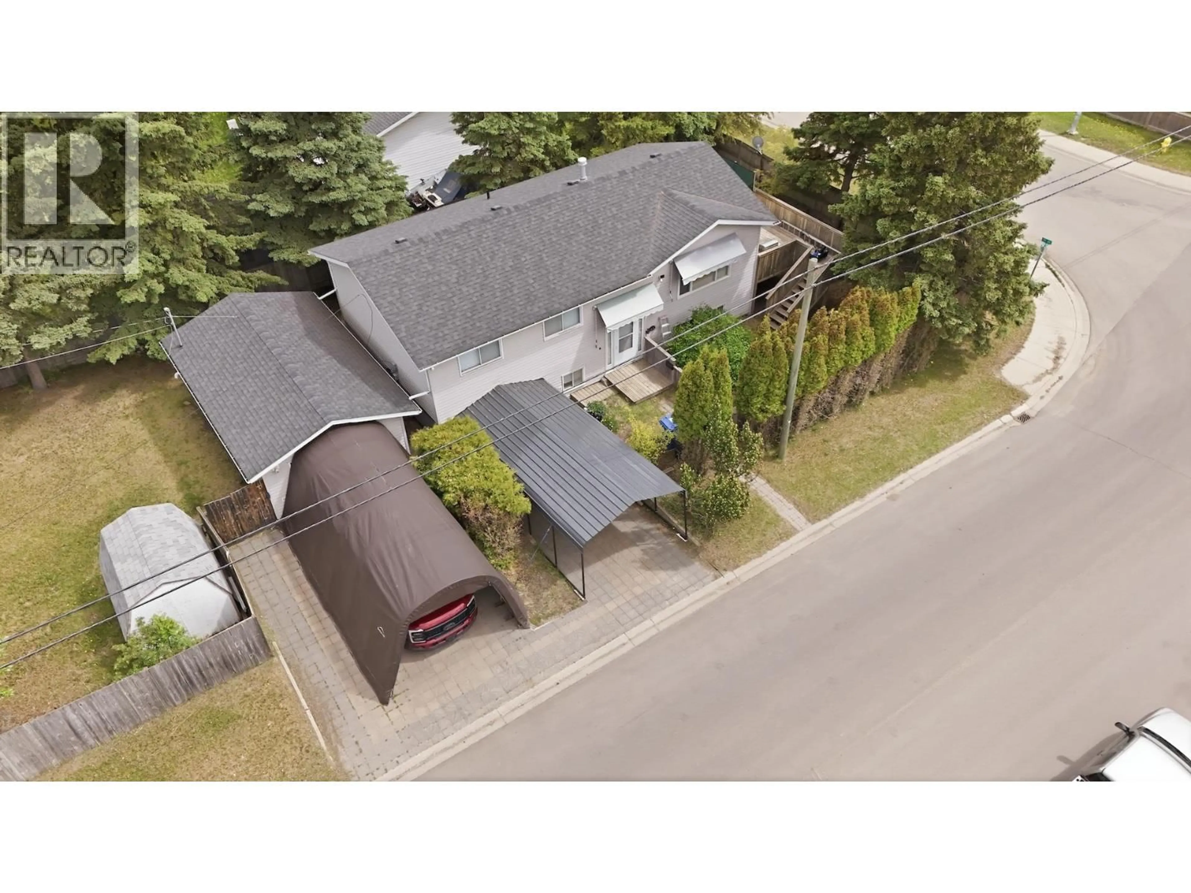 A pic from outside/outdoor area/front of a property/back of a property/a pic from drone, street for 9903 84 STREET, Fort St. John British Columbia V1J4M5