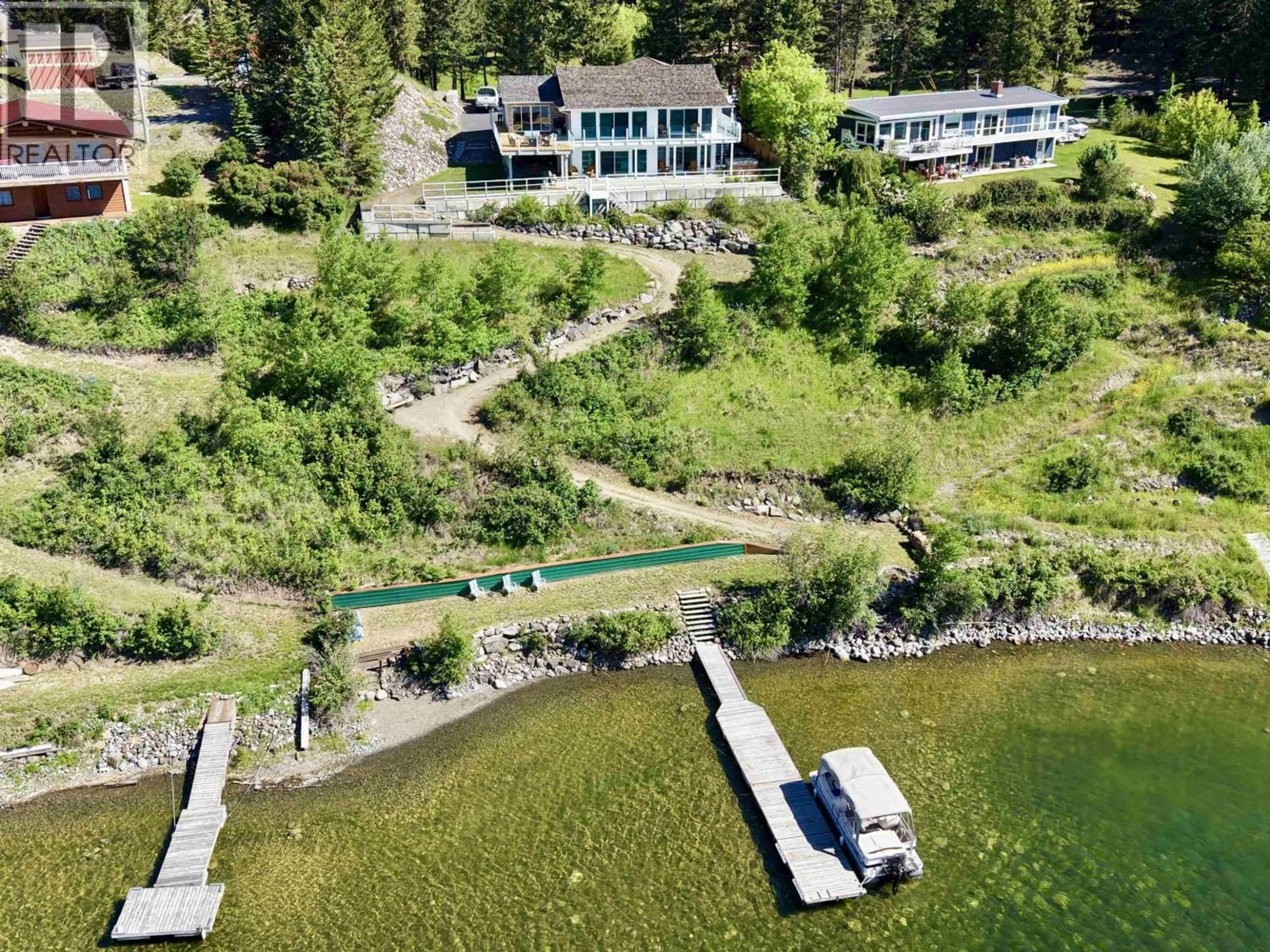 A pic from outside/outdoor area/front of a property/back of a property/a pic from drone, water/lake/river/ocean view for 6168 LAKESHORE DRIVE, Horse Lake British Columbia V0K2E3