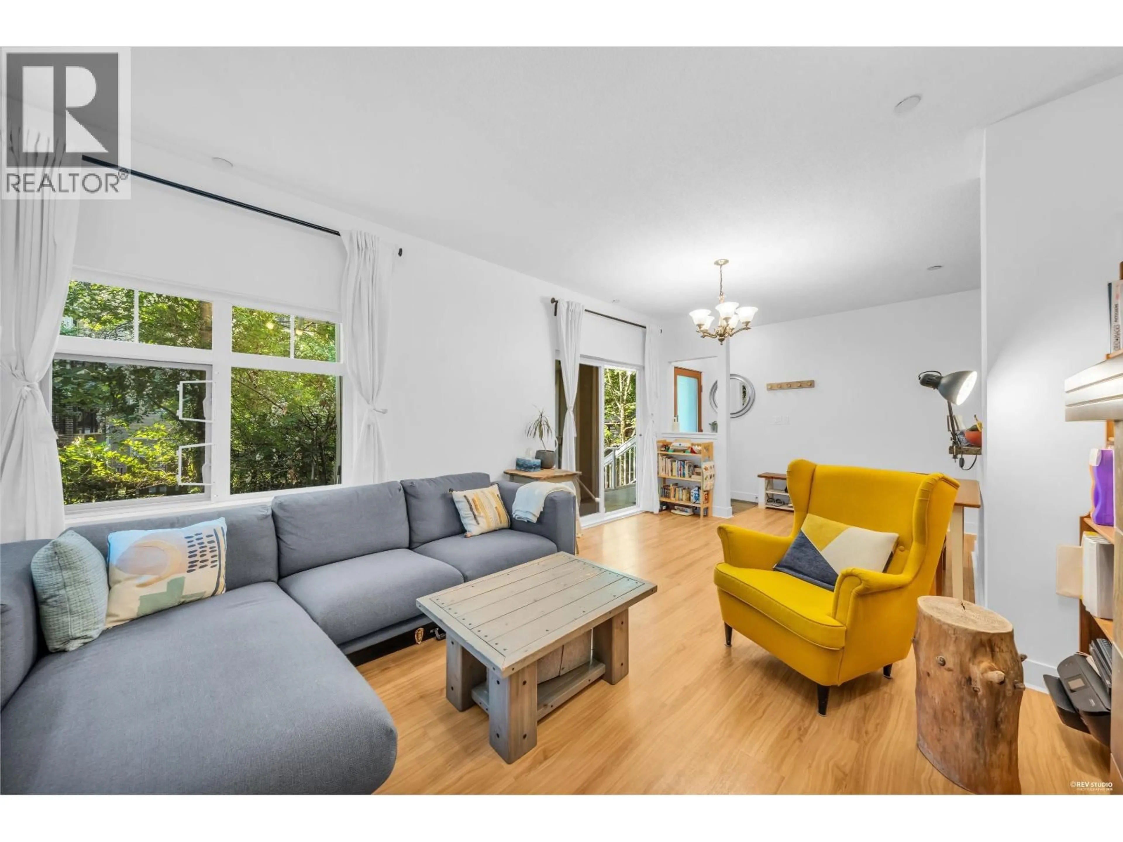 Living room with furniture, wood/laminate floor for 138 - 7388 MACPHERSON AVENUE, Burnaby British Columbia V5J0A1
