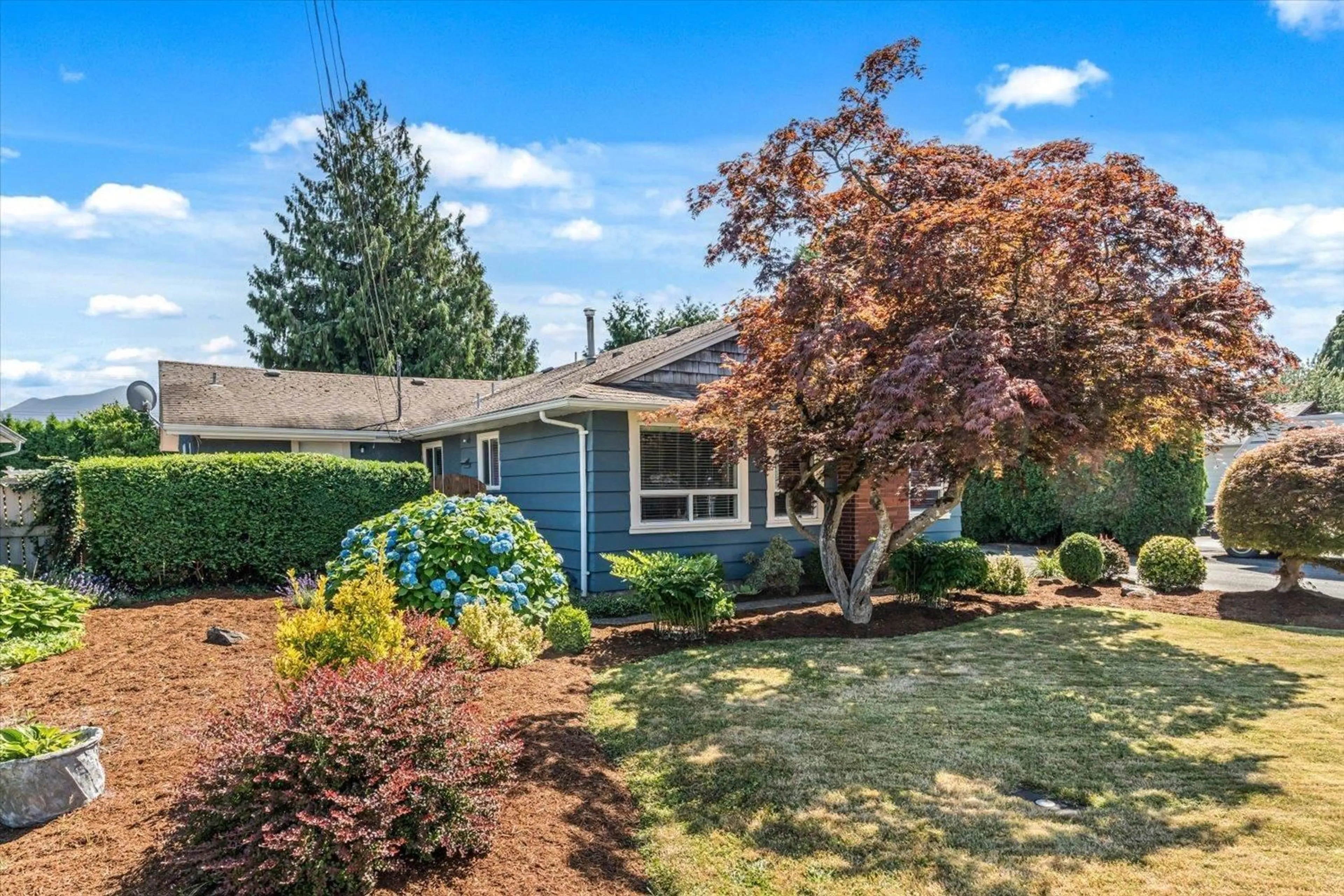 Home with vinyl exterior material, street for 46222 MCCAFFREY BOULEVARD, Chilliwack British Columbia V2P1E1