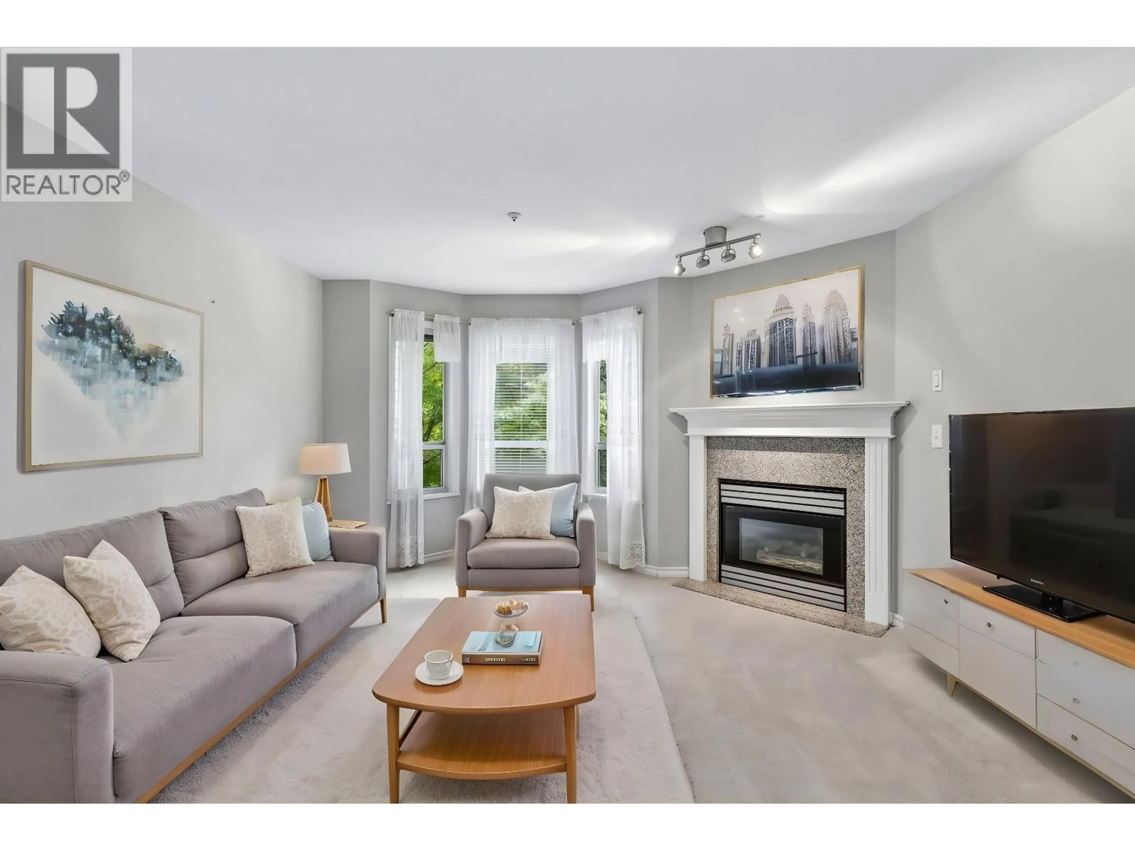 Living room with furniture, unknown for 206 - 1150 LYNN VALLEY ROAD, North Vancouver British Columbia V7J1Z9