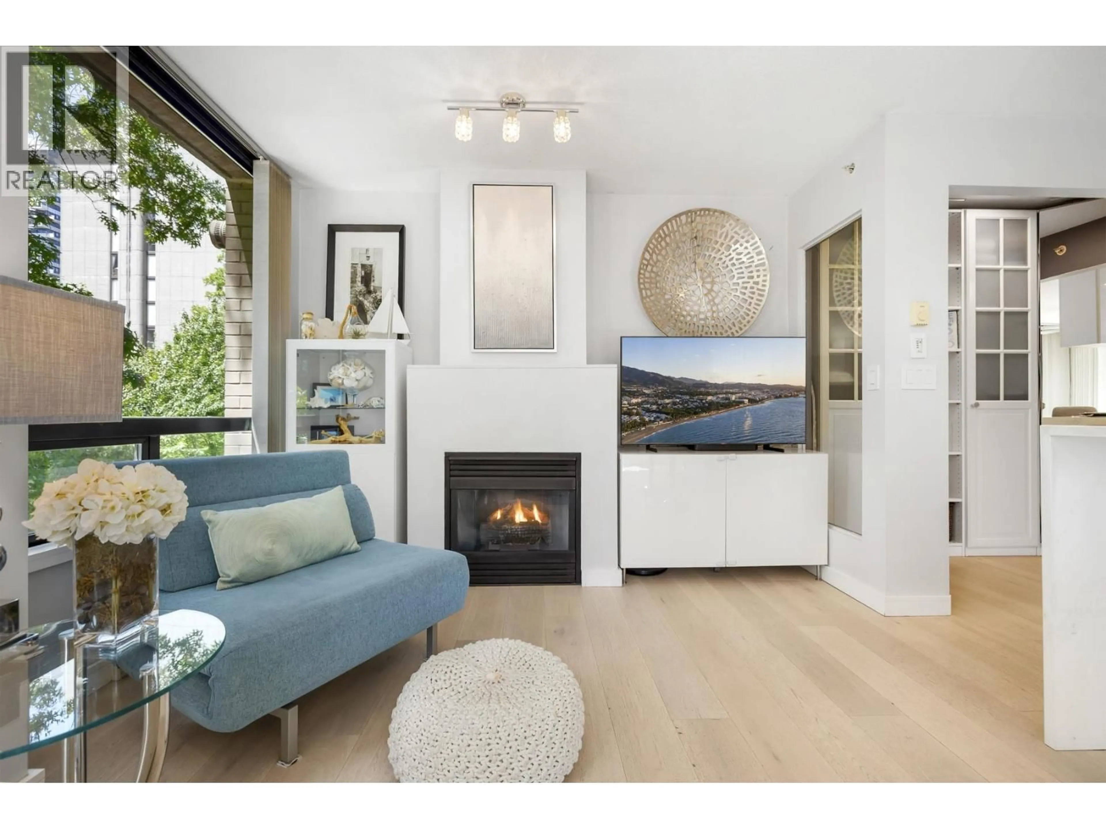 Living room with furniture, wood/laminate floor for 304 - 1003 BURNABY STREET, Vancouver British Columbia V6E4R7