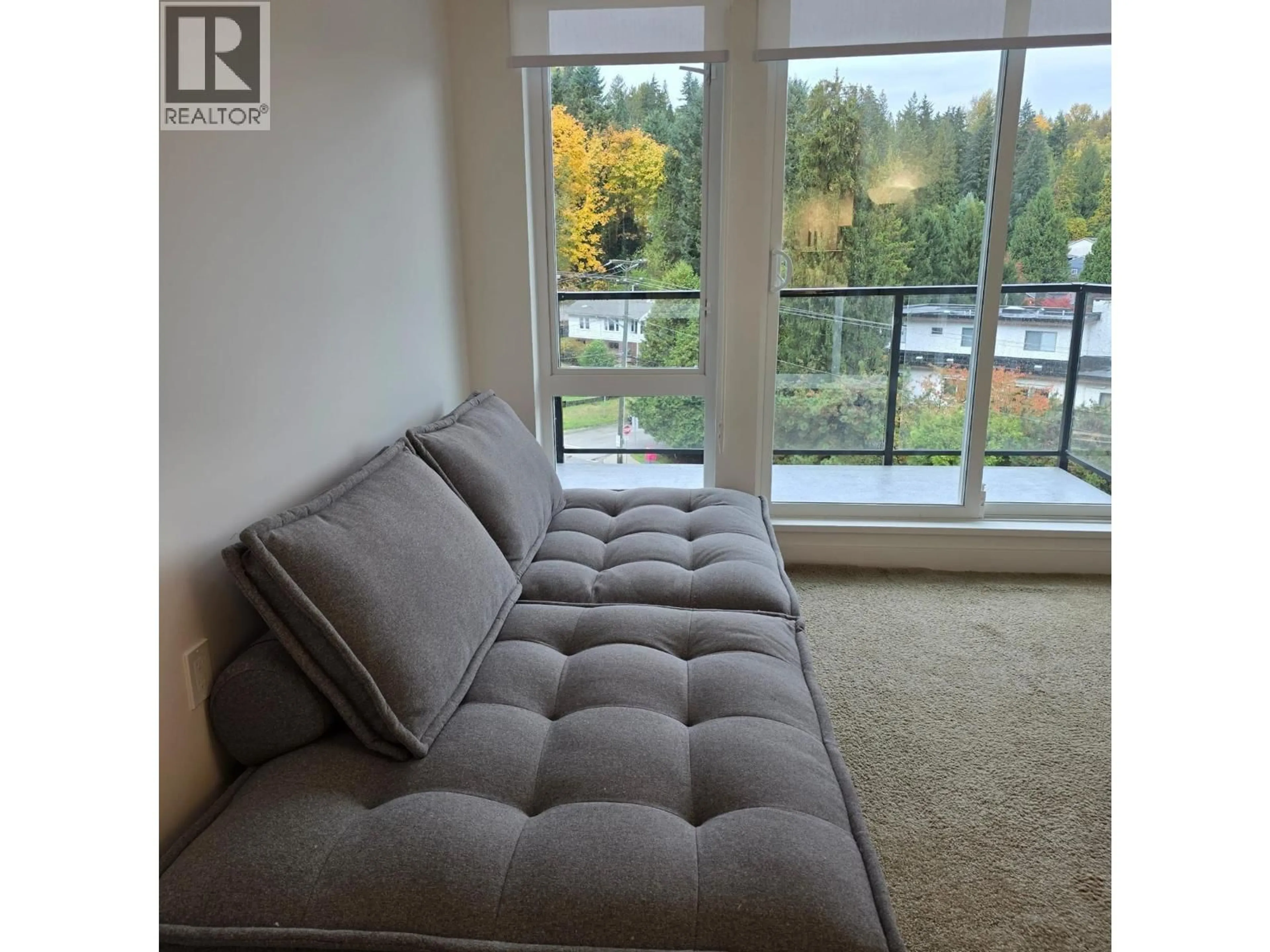 Living room with furniture, unknown for 406 - 1100 CLARKE ROAD, Port Moody British Columbia V3H0N3