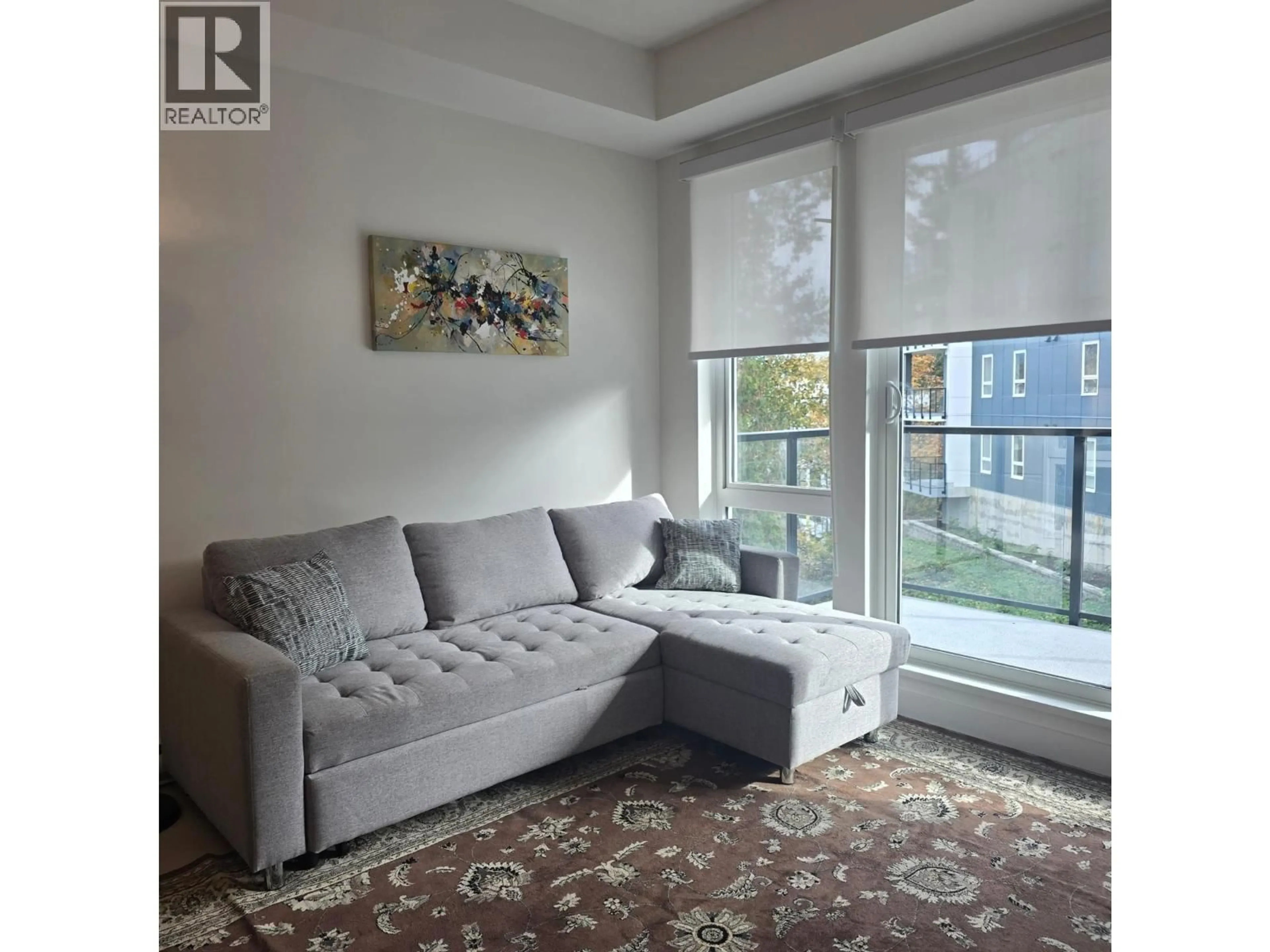 Living room with furniture, unknown for 411 - 1100 CLARKE ROAD, Port Moody British Columbia V3H0N3