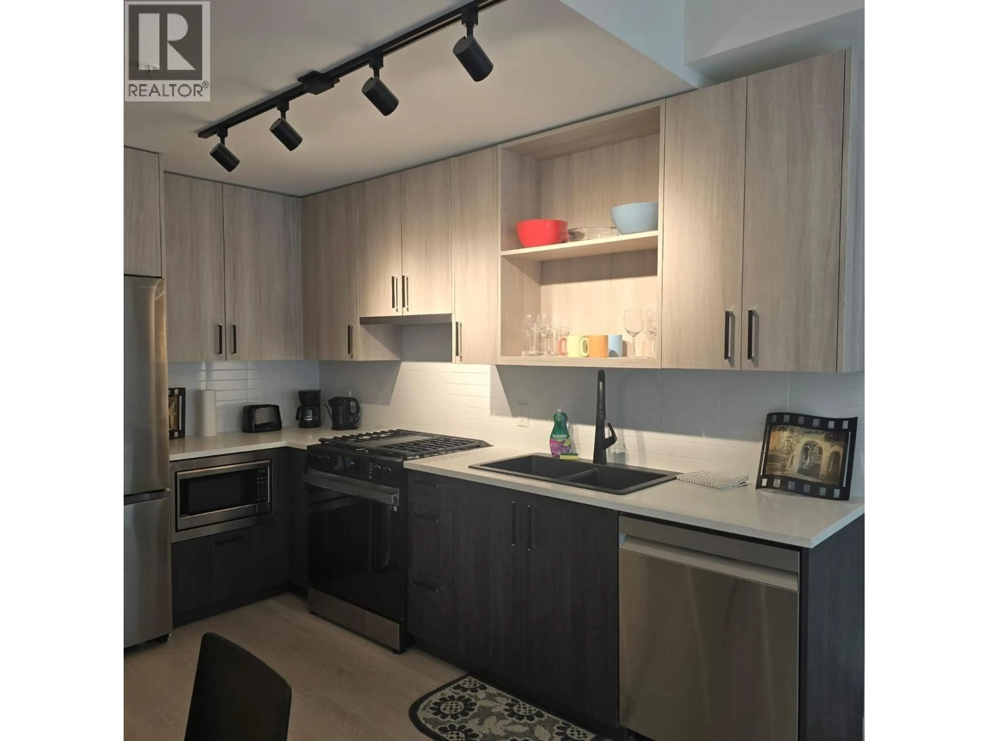 Open concept kitchen, wood/laminate floor for 411 - 1100 CLARKE ROAD, Port Moody British Columbia V3H0N3