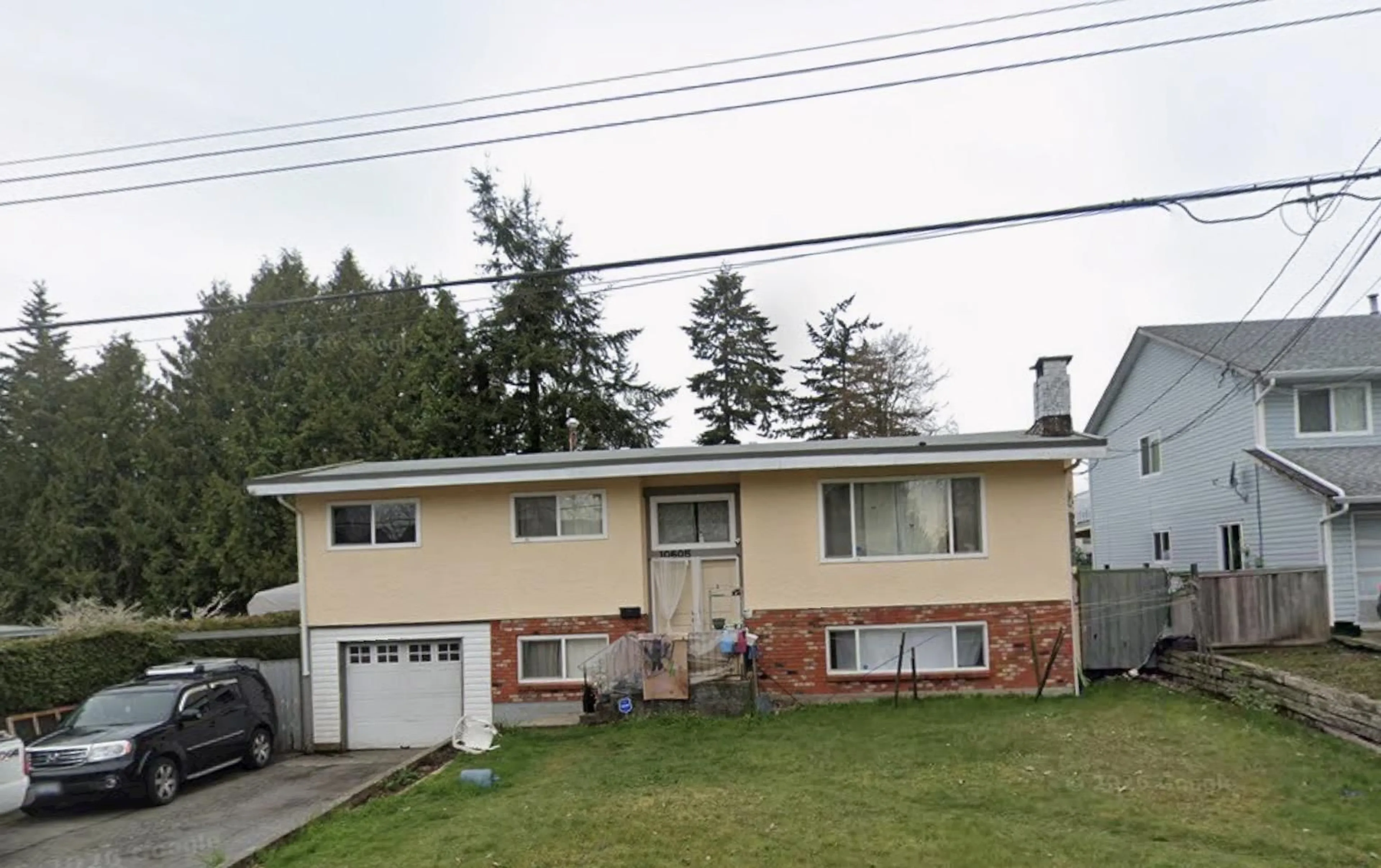 Home with vinyl exterior material, street for 10605 138A STREET, Surrey British Columbia V3T4L2