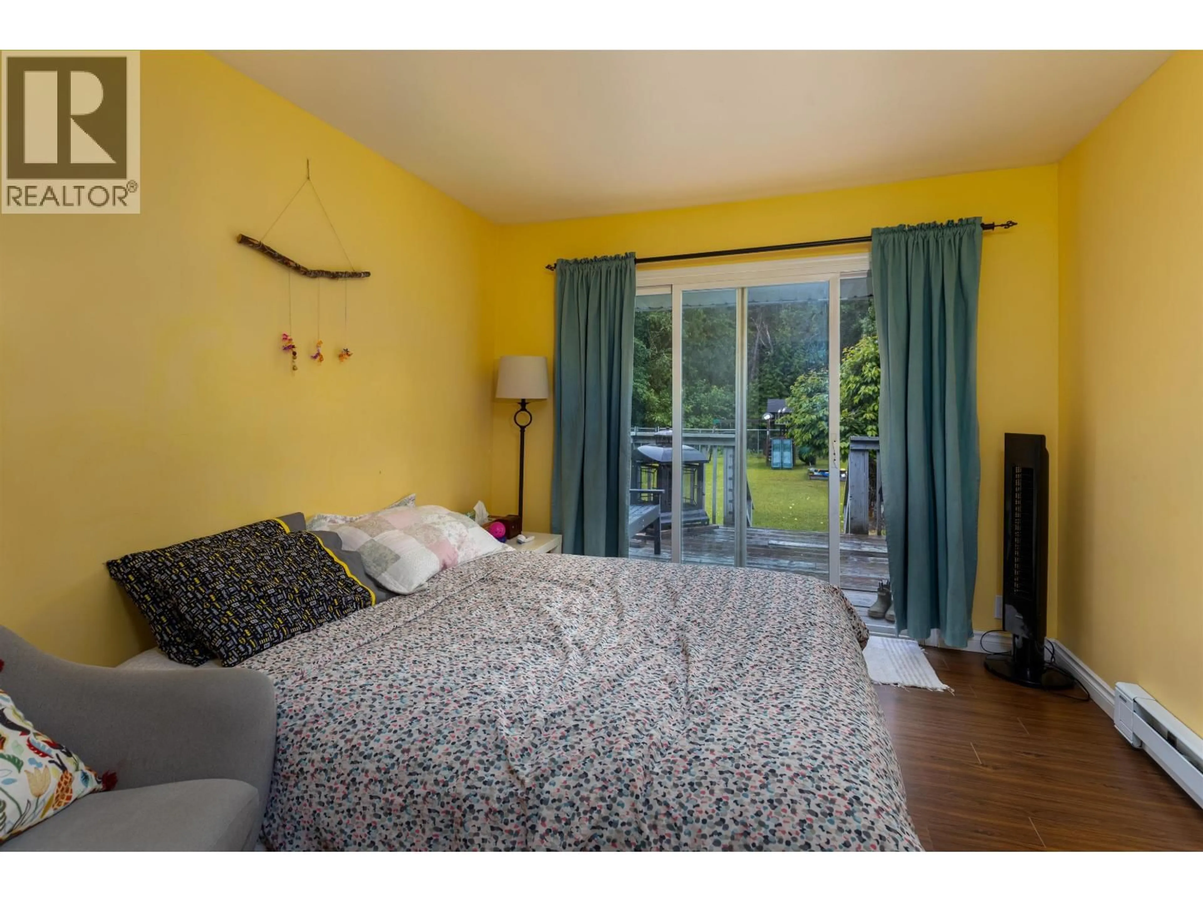 Bedroom with bed, wood/laminate floor for 5033 AGAR AVENUE, Terrace British Columbia V8G1H9