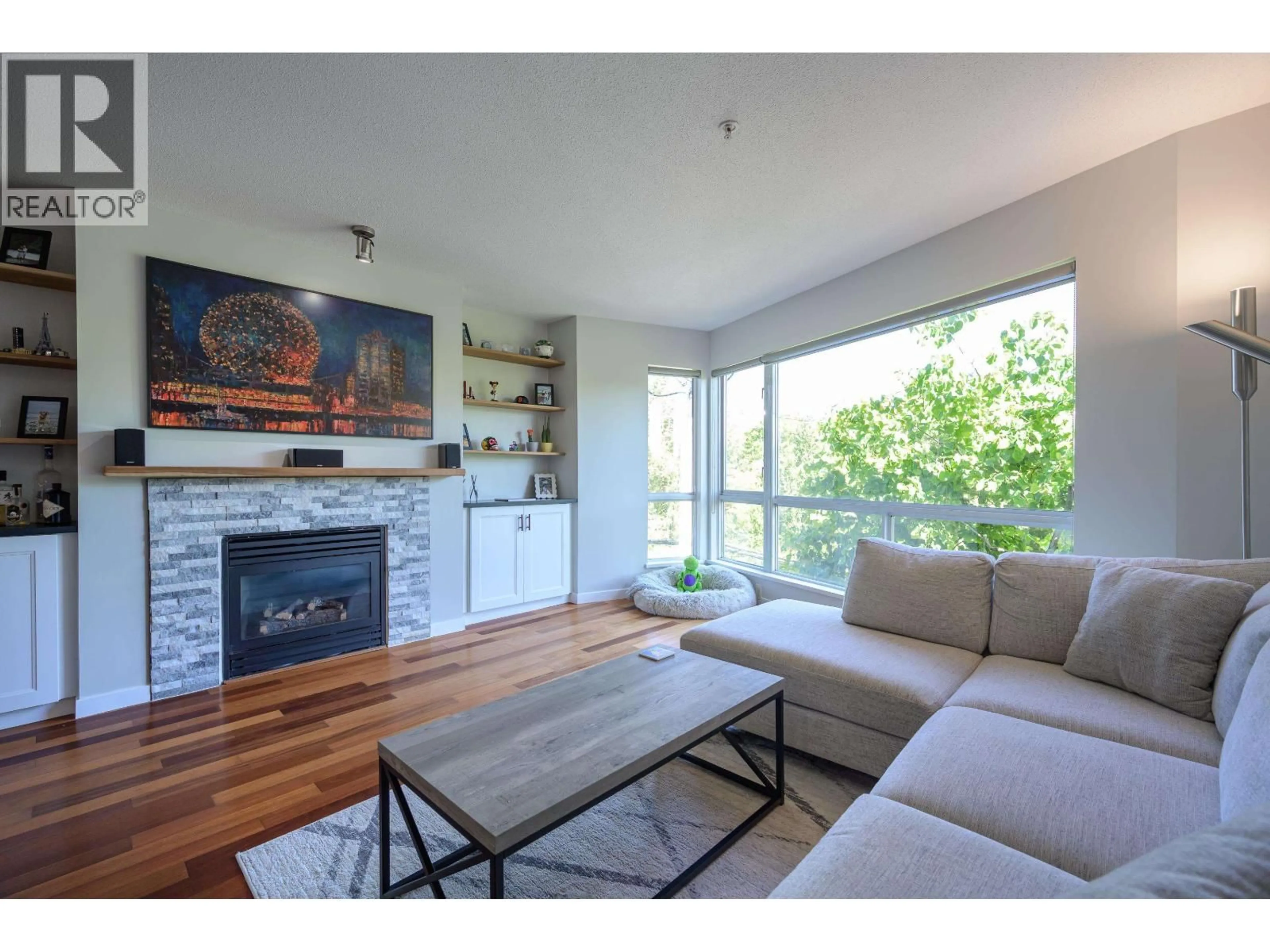 Living room with furniture, wood/laminate floor for 220 - 676 6TH AVENUE, Vancouver British Columbia V5Z1A3