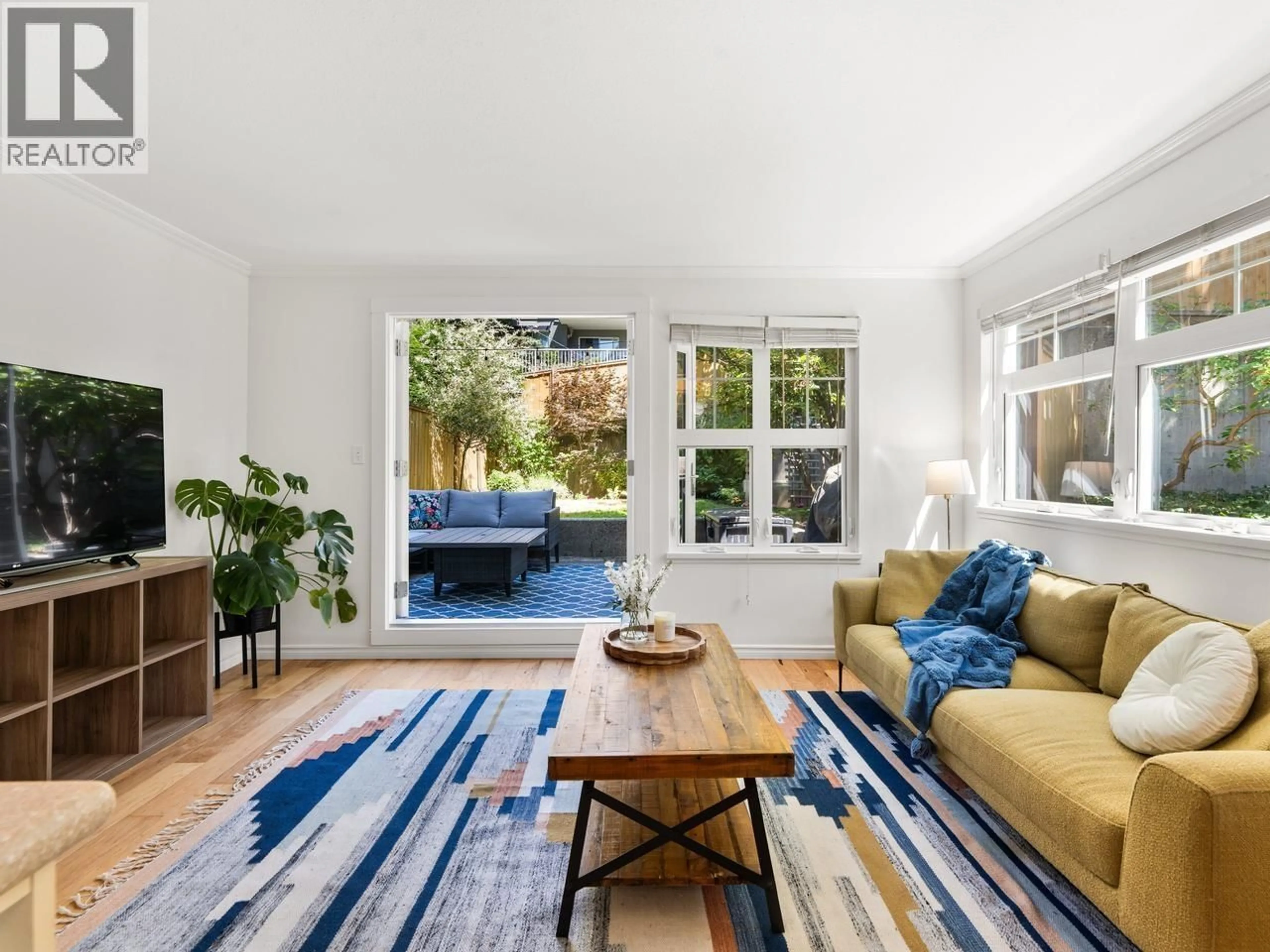 Living room with furniture, unknown for 210 - 3787 PENDER STREET, Burnaby British Columbia V5C2L2