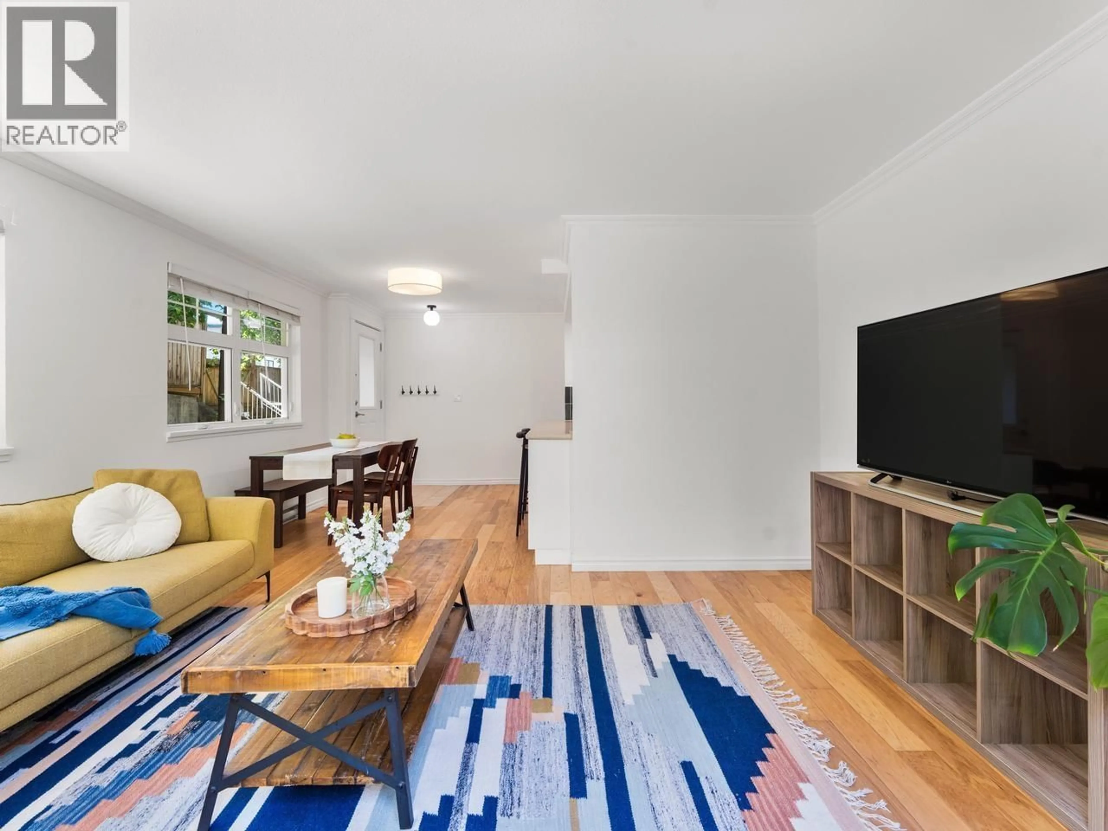 Living room with furniture, unknown for 210 - 3787 PENDER STREET, Burnaby British Columbia V5C2L2