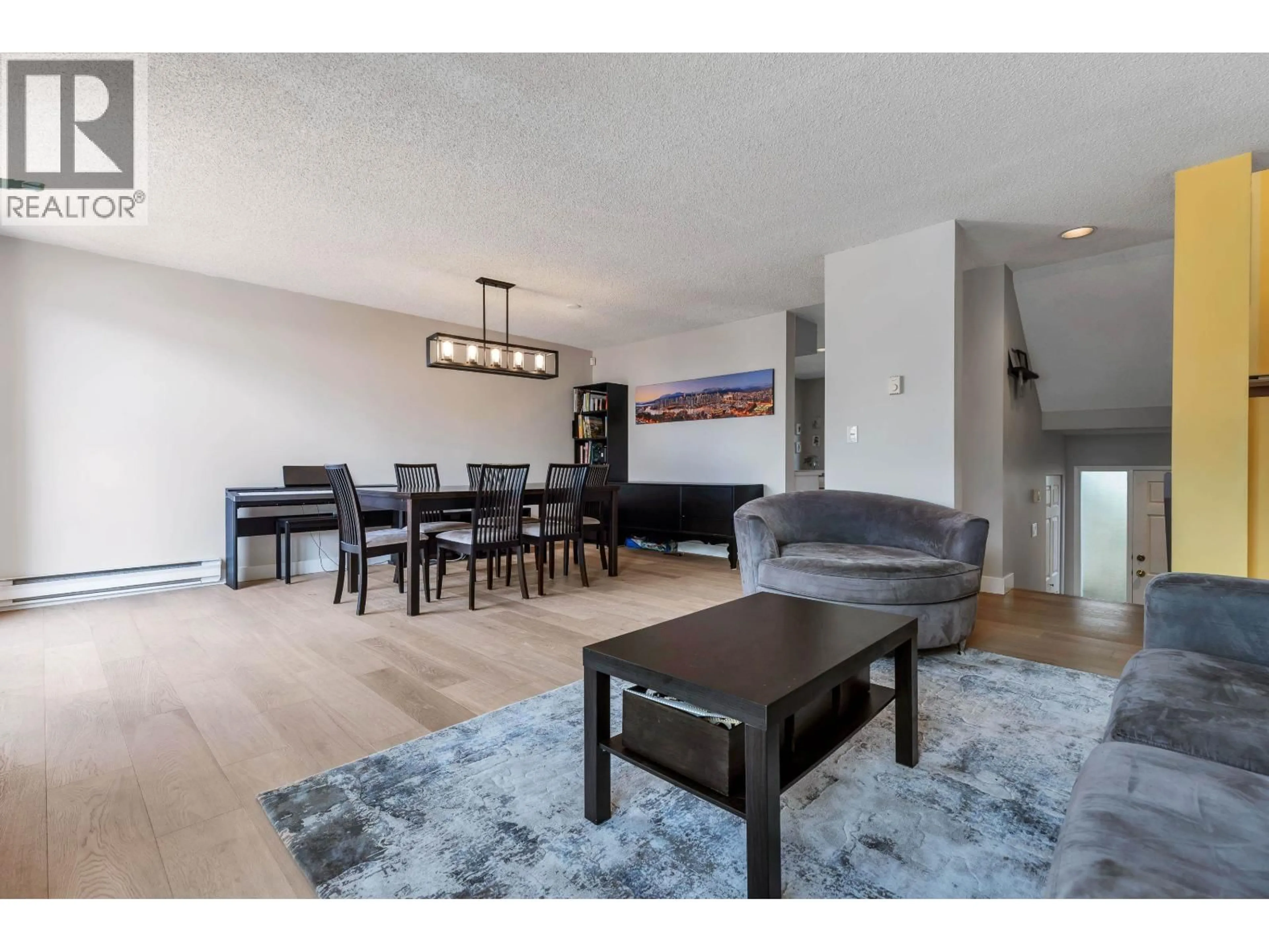 Living room with furniture, wood/laminate floor for 304 - 223 KEITH ROAD, North Vancouver British Columbia V7L1V4