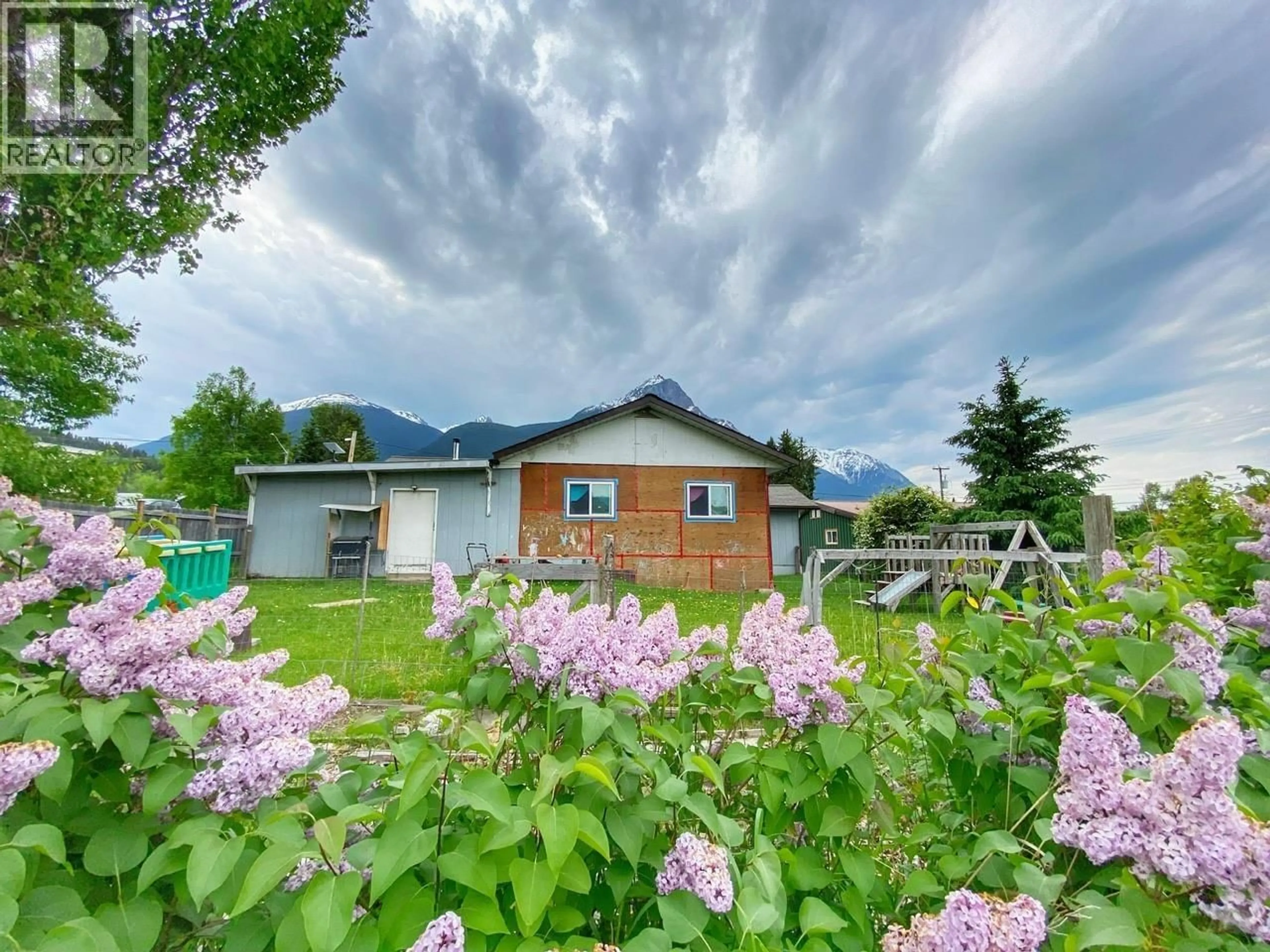 A pic from outside/outdoor area/front of a property/back of a property/a pic from drone, mountain view for 4225 12TH AVENUE, New Hazelton British Columbia V0J2J0