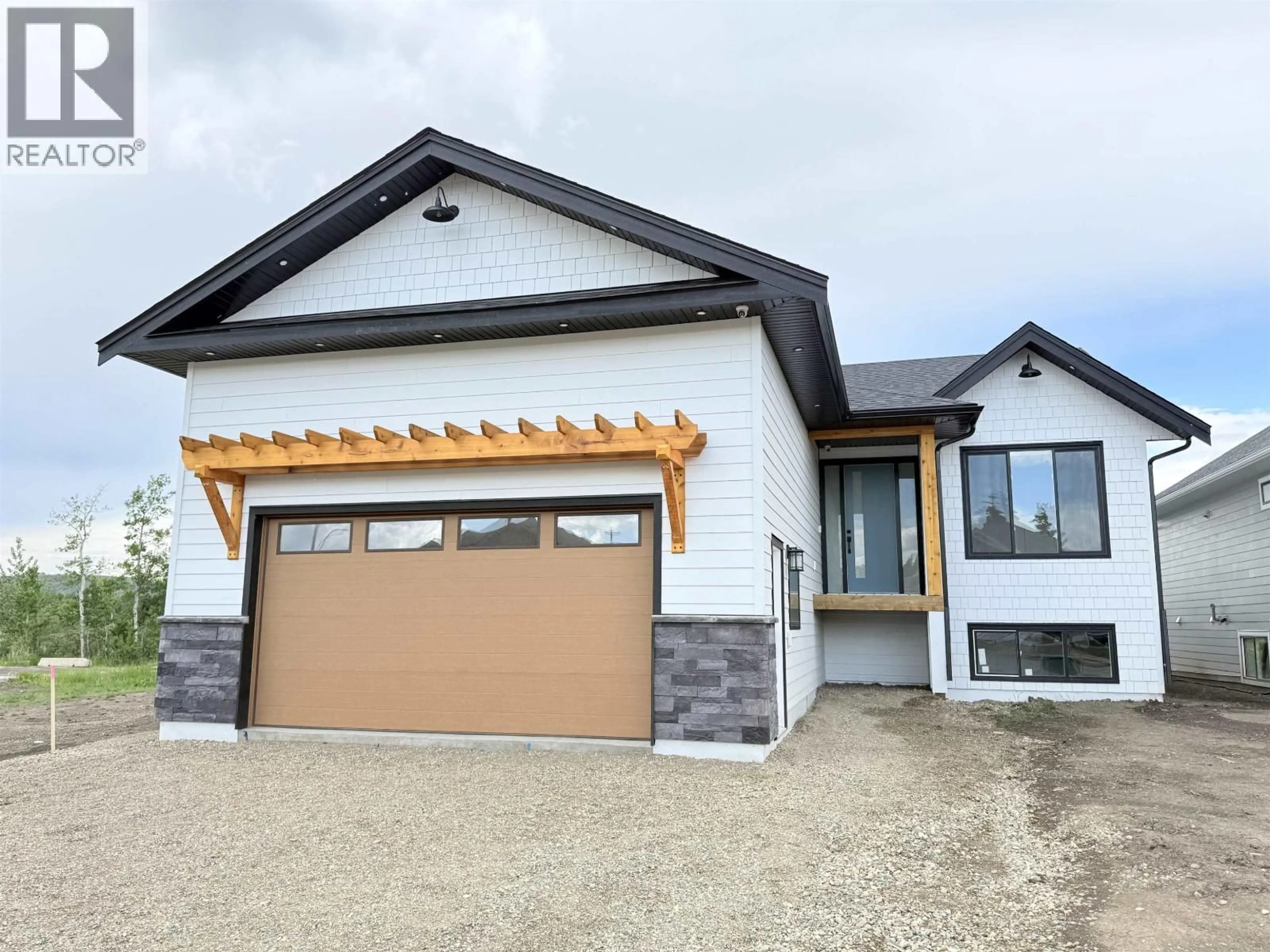Home with brick exterior material, street for 10712 114A AVENUE, Fort St. John British Columbia V1J0S1
