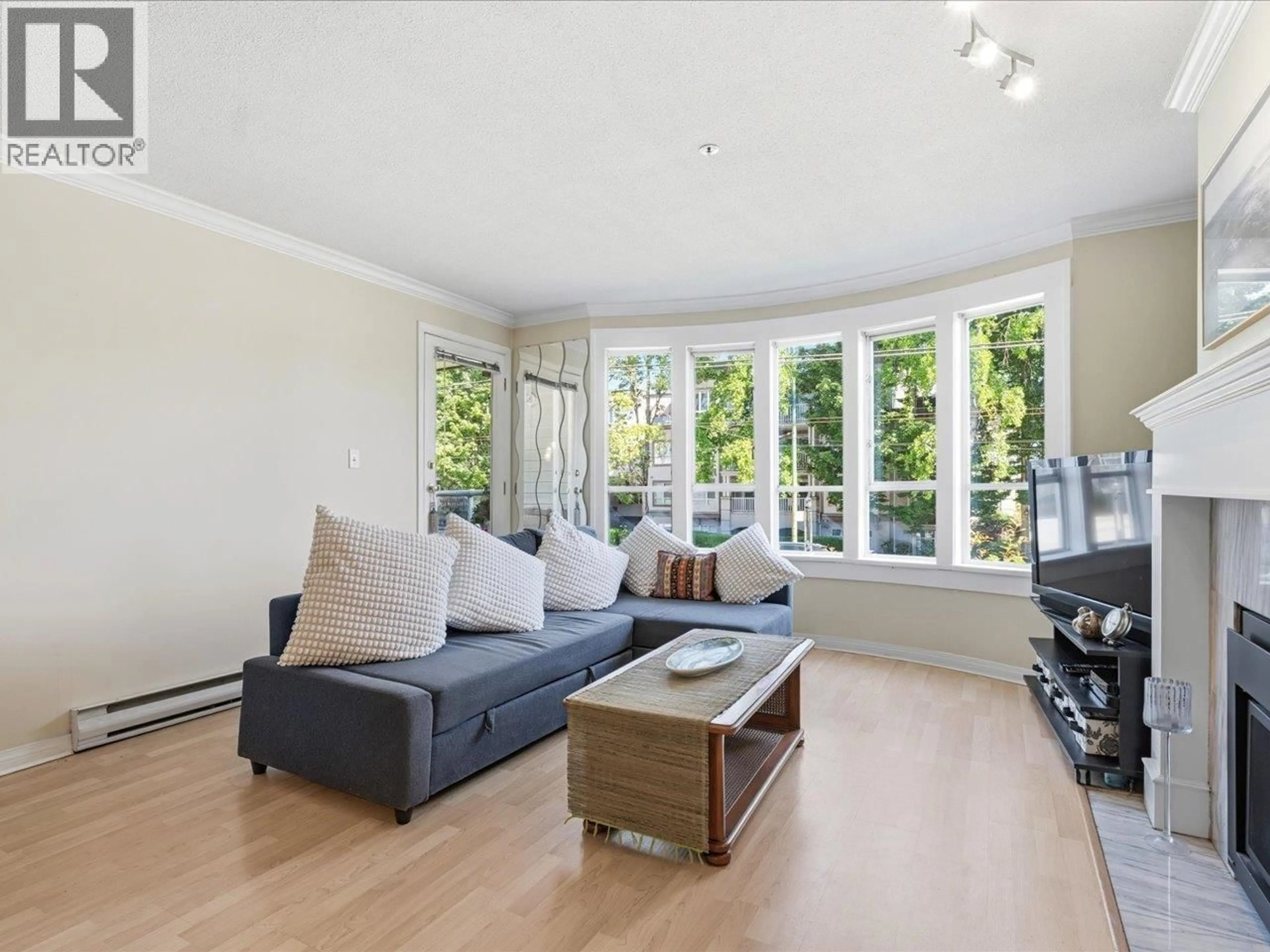 Living room with furniture, wood/laminate floor for 201 - 3220 4TH AVENUE, Vancouver British Columbia V6K1R9
