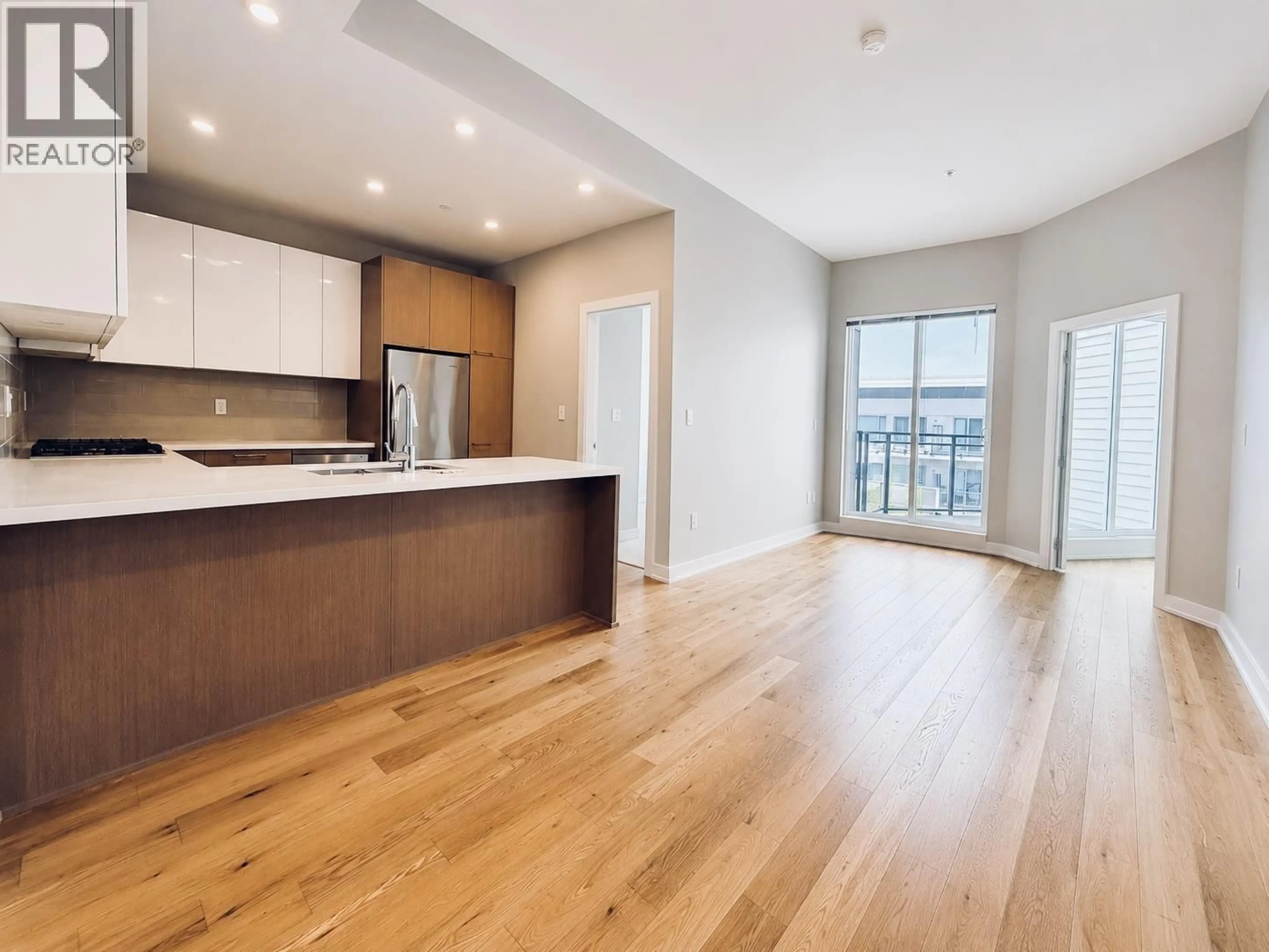 Open concept kitchen, wood/laminate floor for 719 - 5399 CEDARBRIDGE WAY, Richmond British Columbia V6X0L6