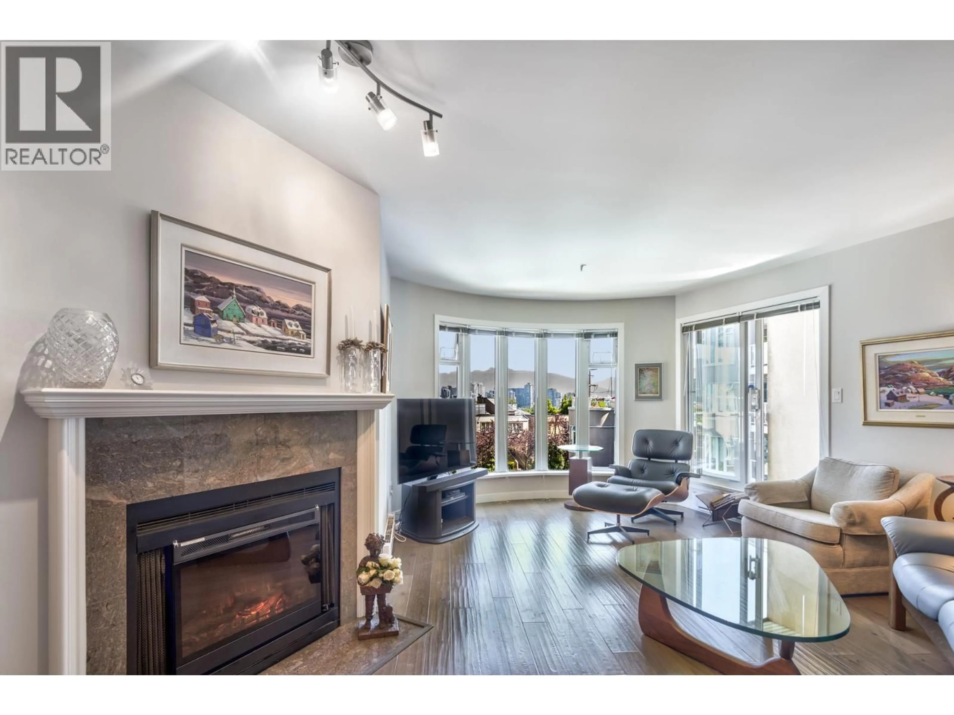 Living room with furniture, wood/laminate floor for 310 - 1236 8TH AVENUE, Vancouver British Columbia V6H3Y9