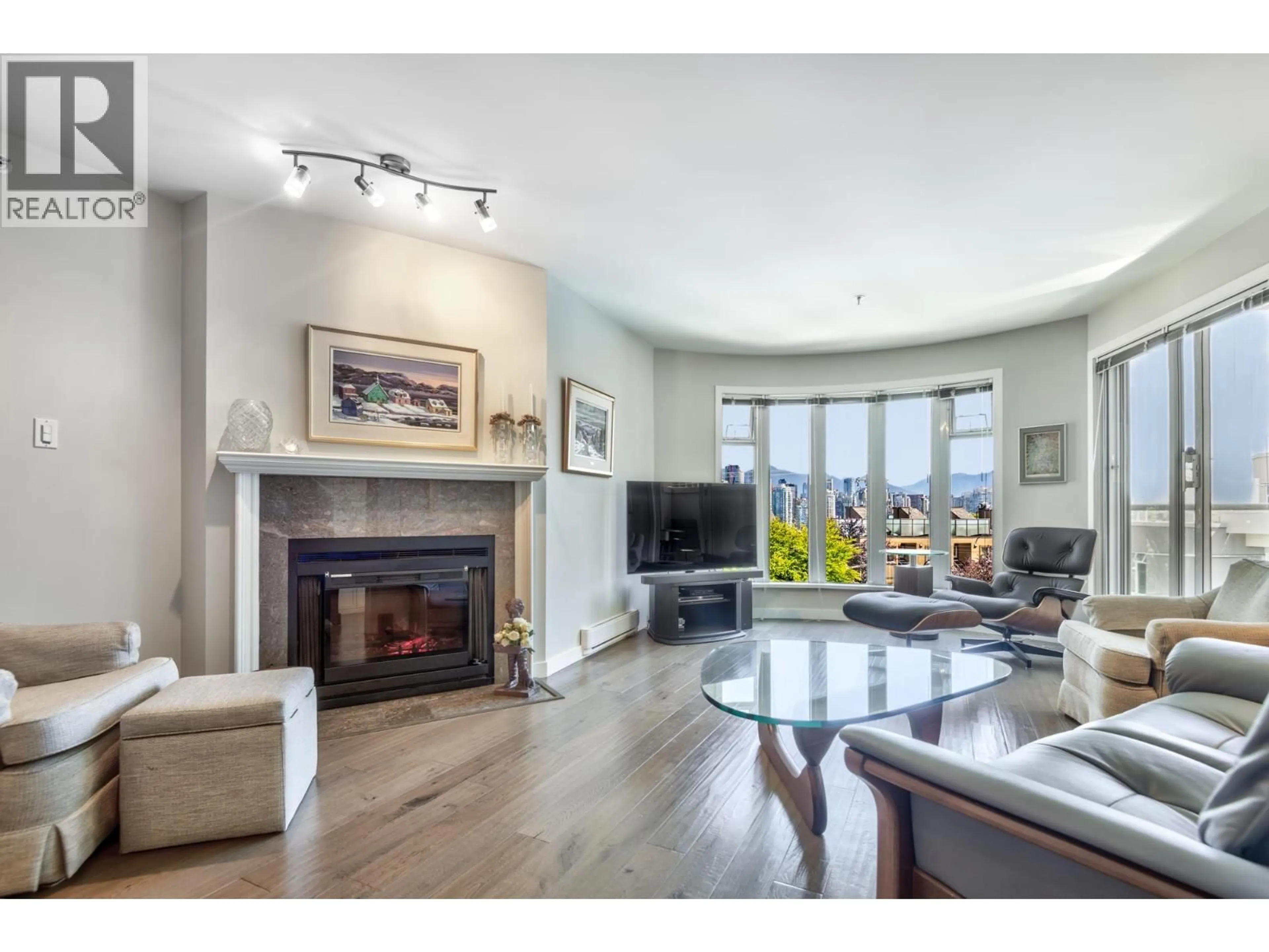 Living room with furniture, wood/laminate floor for 310 - 1236 8TH AVENUE, Vancouver British Columbia V6H3Y9