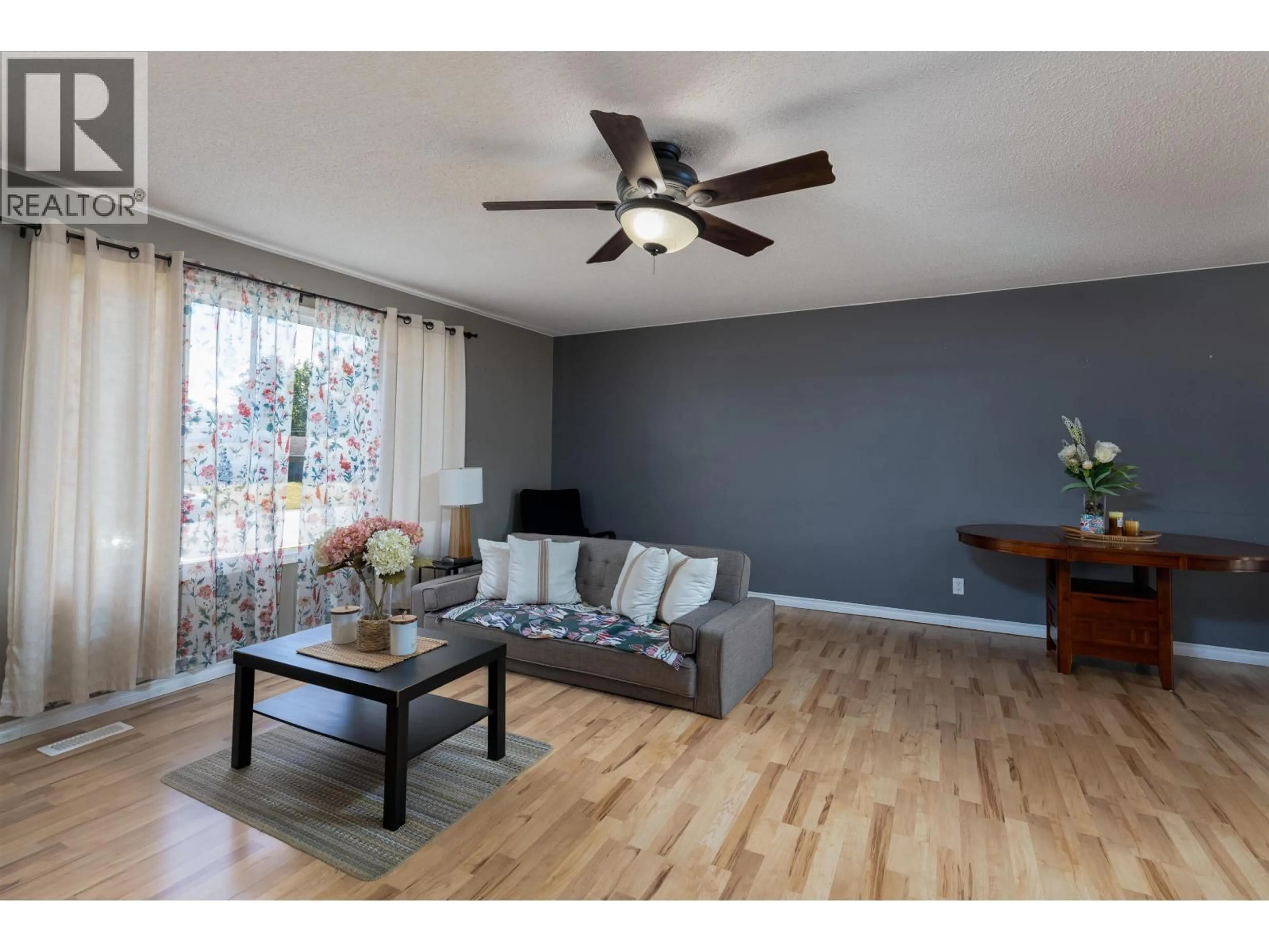 Living room with furniture, wood/laminate floor for 4920 LAZELLE AVENUE, Terrace British Columbia V8G1T7