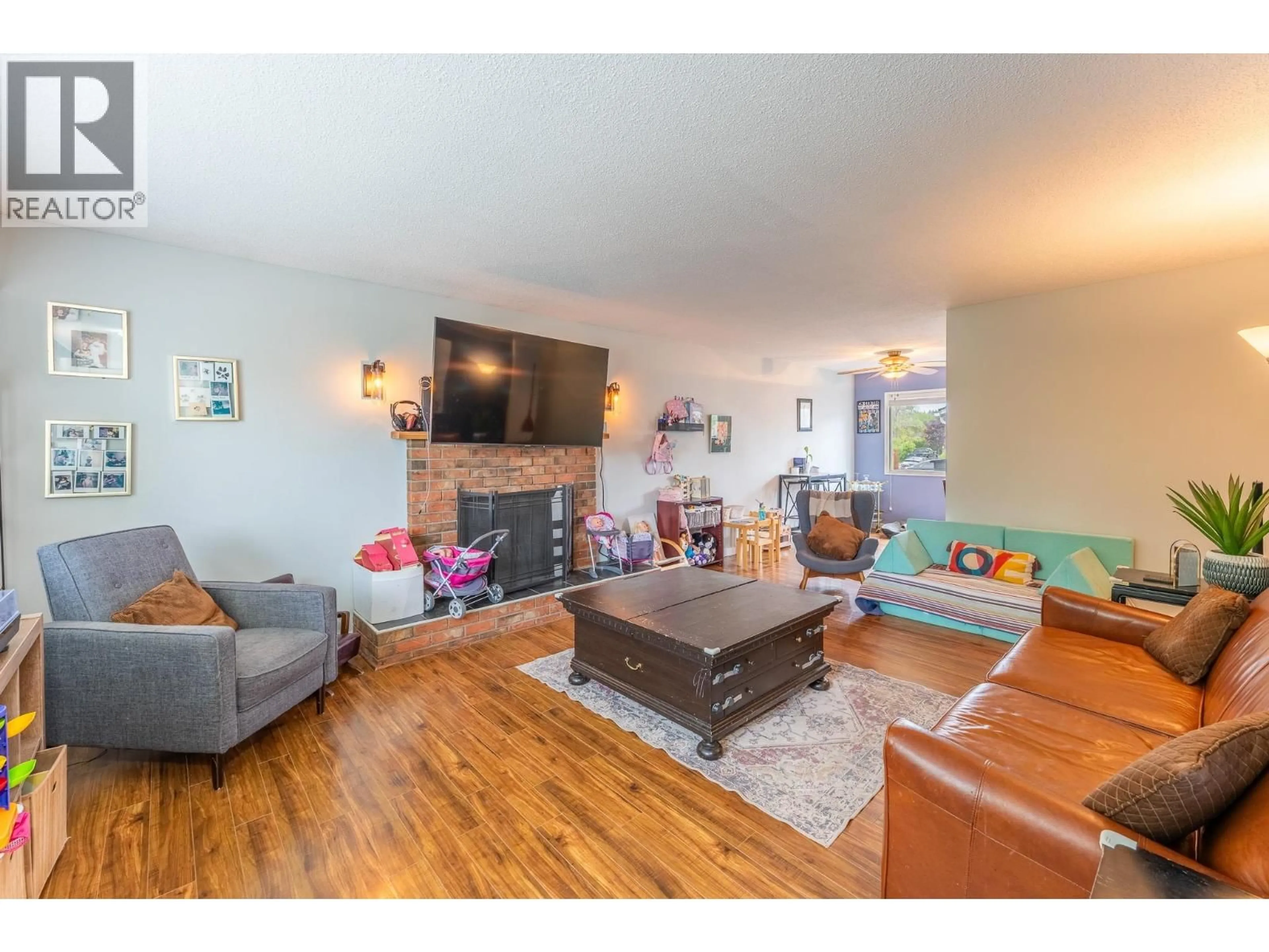 Living room with furniture, wood/laminate floor for 112 MCQUEEN CRESCENT, Prince George British Columbia V2M4R8
