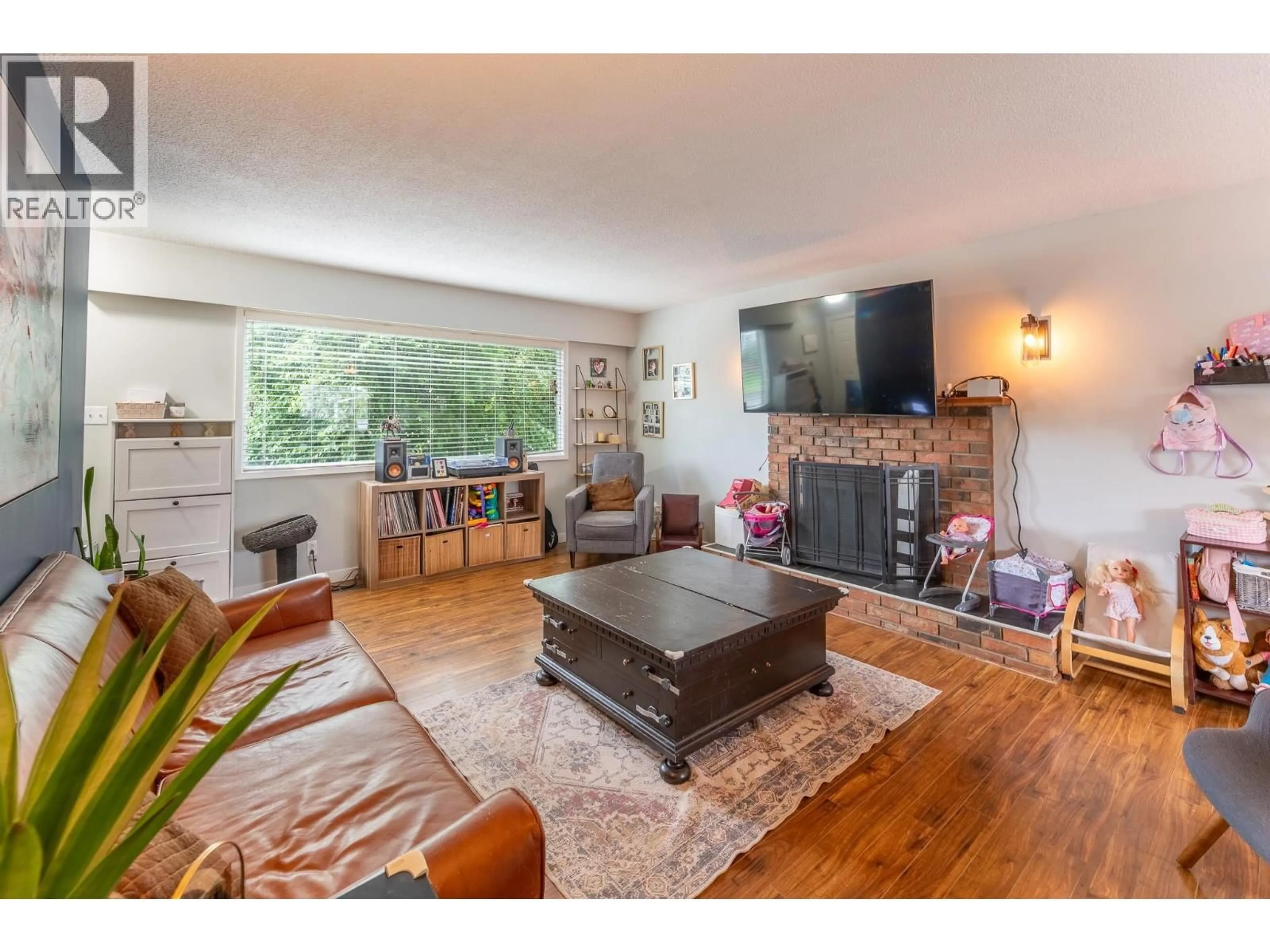 Living room with furniture, wood/laminate floor for 112 MCQUEEN CRESCENT, Prince George British Columbia V2M4R8