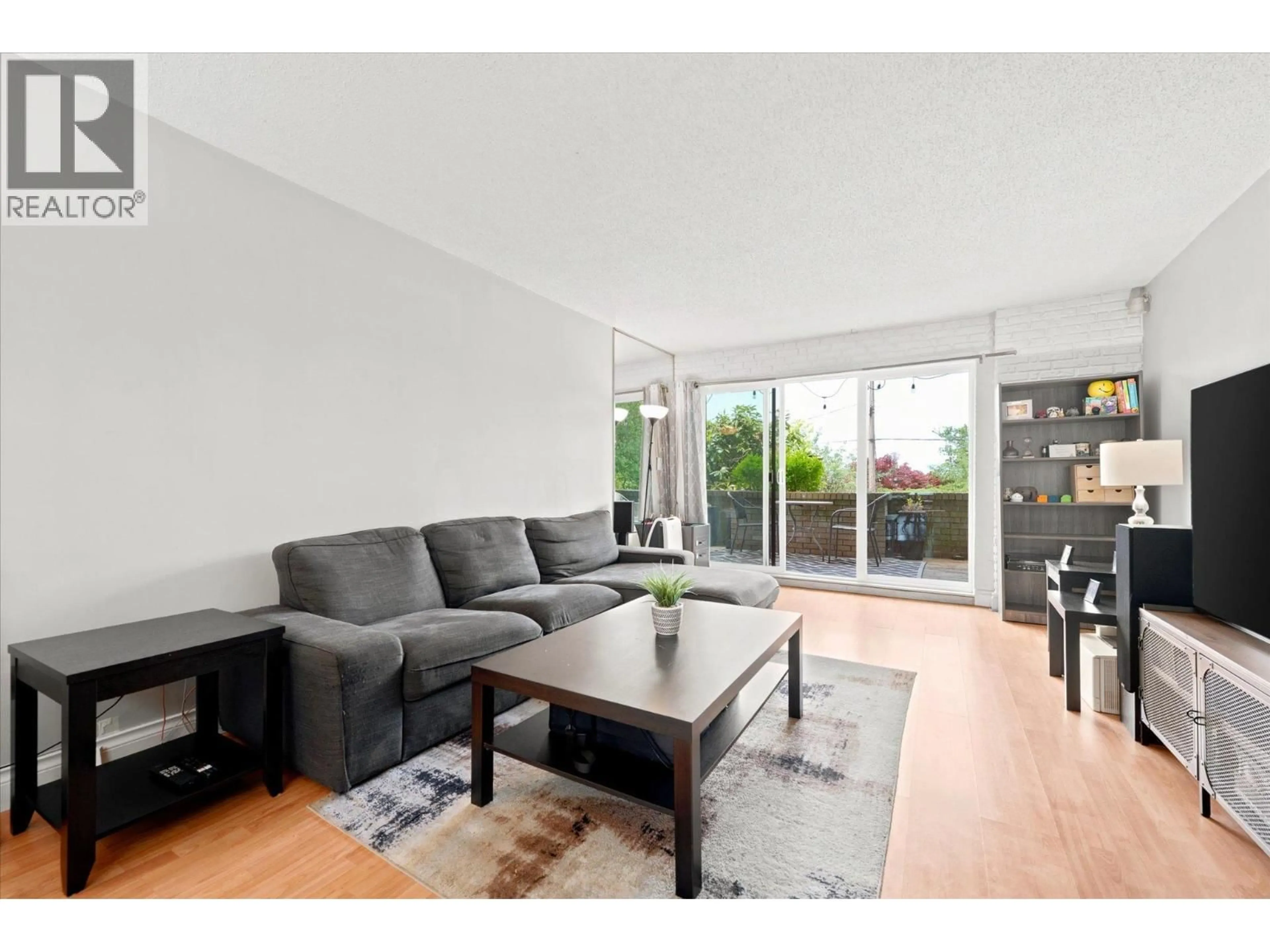 Living room with furniture, wood/laminate floor for 101 - 2240 WALL STREET, Vancouver British Columbia V5L1B6