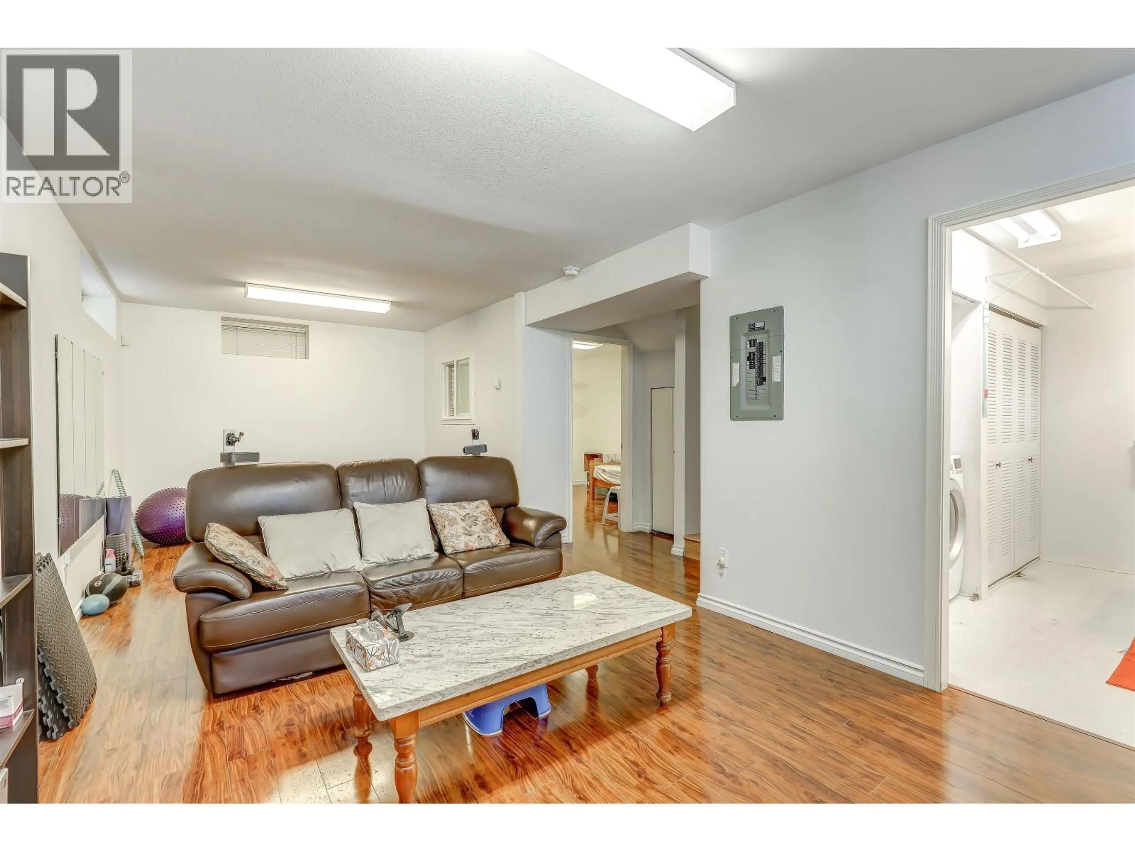 Living room with furniture, wood/laminate floor for 4723 VILLAGE DRIVE, Burnaby British Columbia V5G4V7