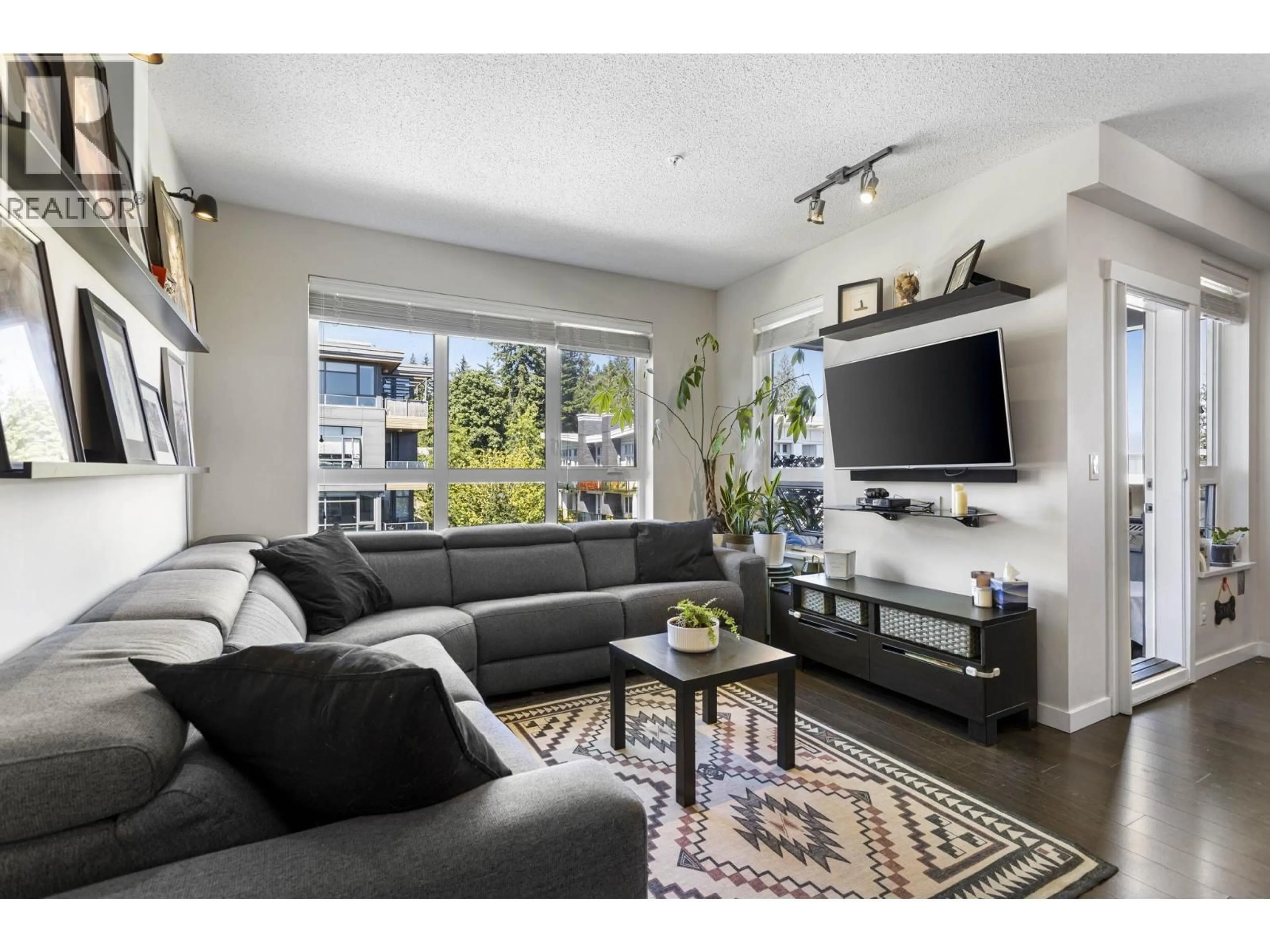 Living room with furniture, unknown for 502 - 9168 SLOPES MEWS, Burnaby British Columbia V5A0E4