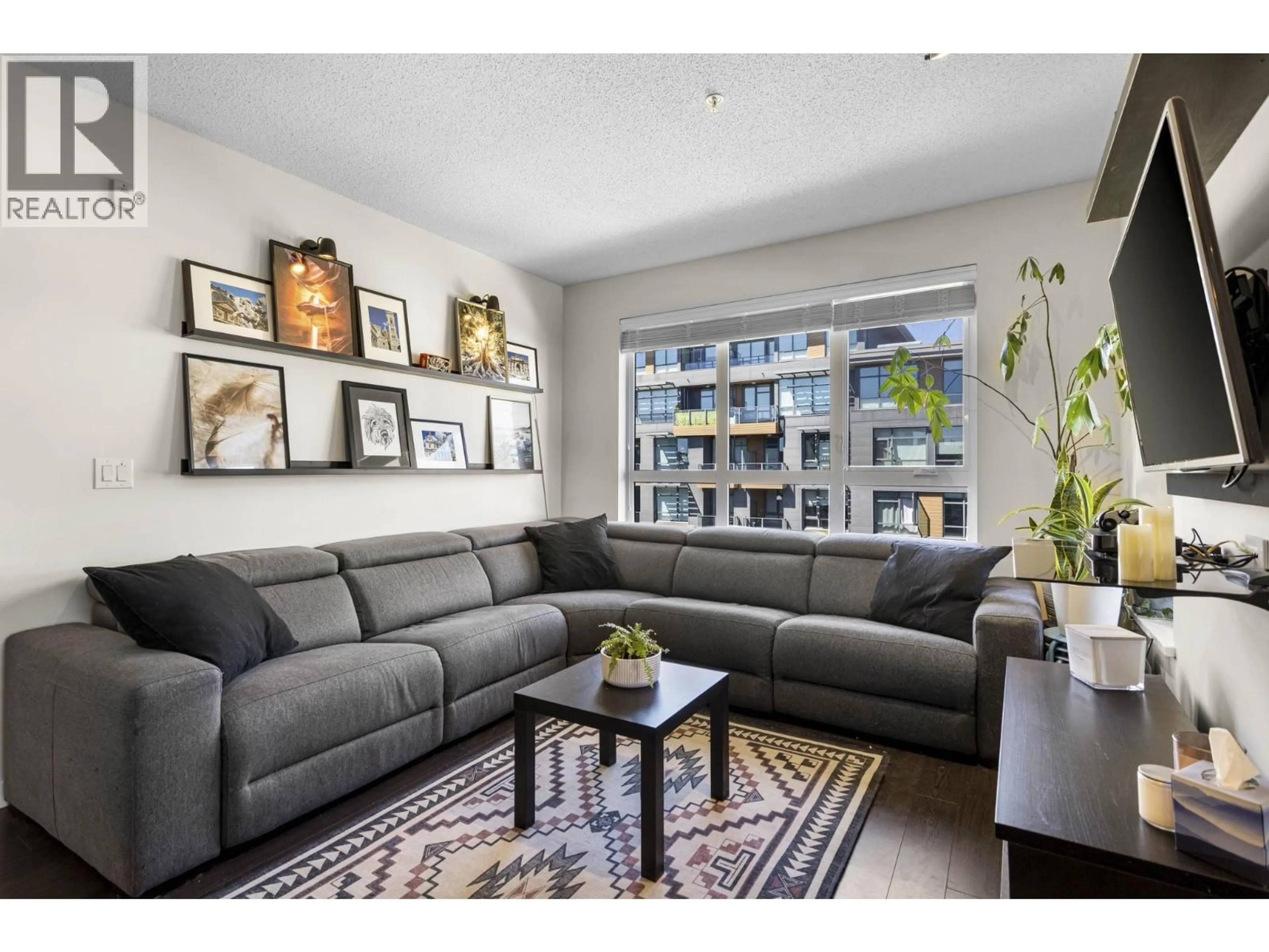 Living room with furniture, unknown for 502 - 9168 SLOPES MEWS, Burnaby British Columbia V5A0E4