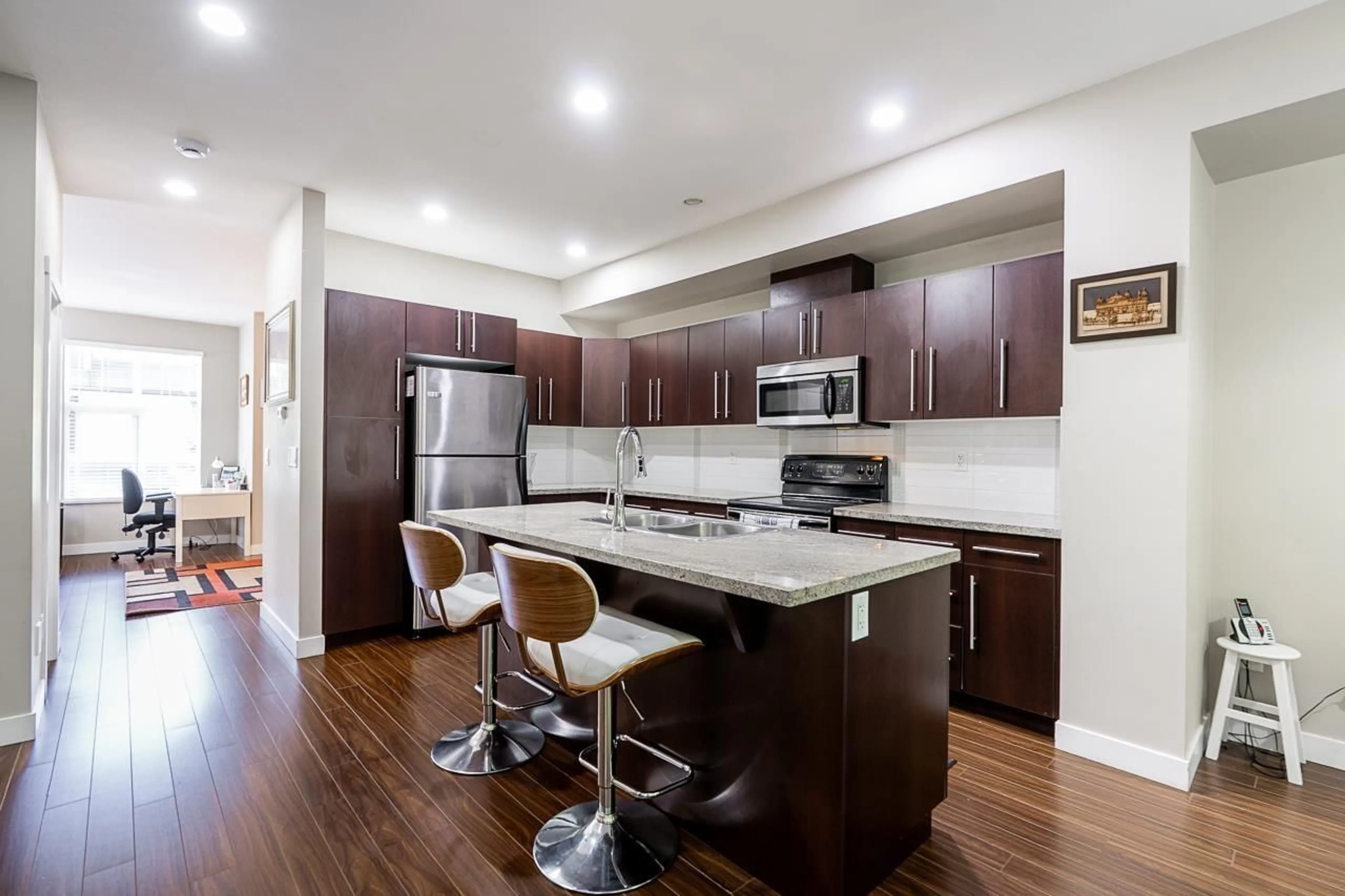 Open concept kitchen, wood/laminate floor for 94 - 18199 70 AVENUE, Surrey British Columbia V3S2N9