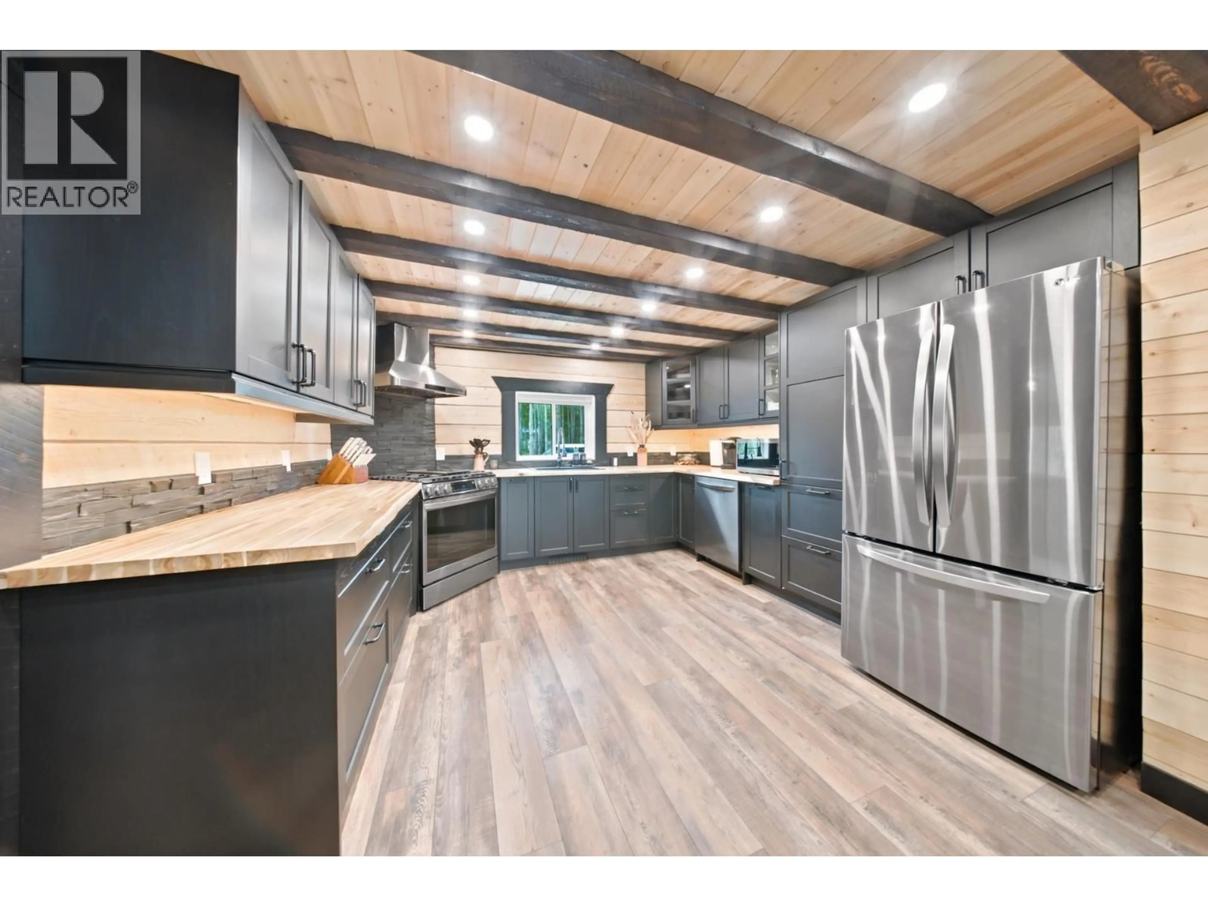 Open concept kitchen, wood/laminate floor for 14452 WELCH SUBDIVISION ROAD, Fort St. John British Columbia V1J8L6