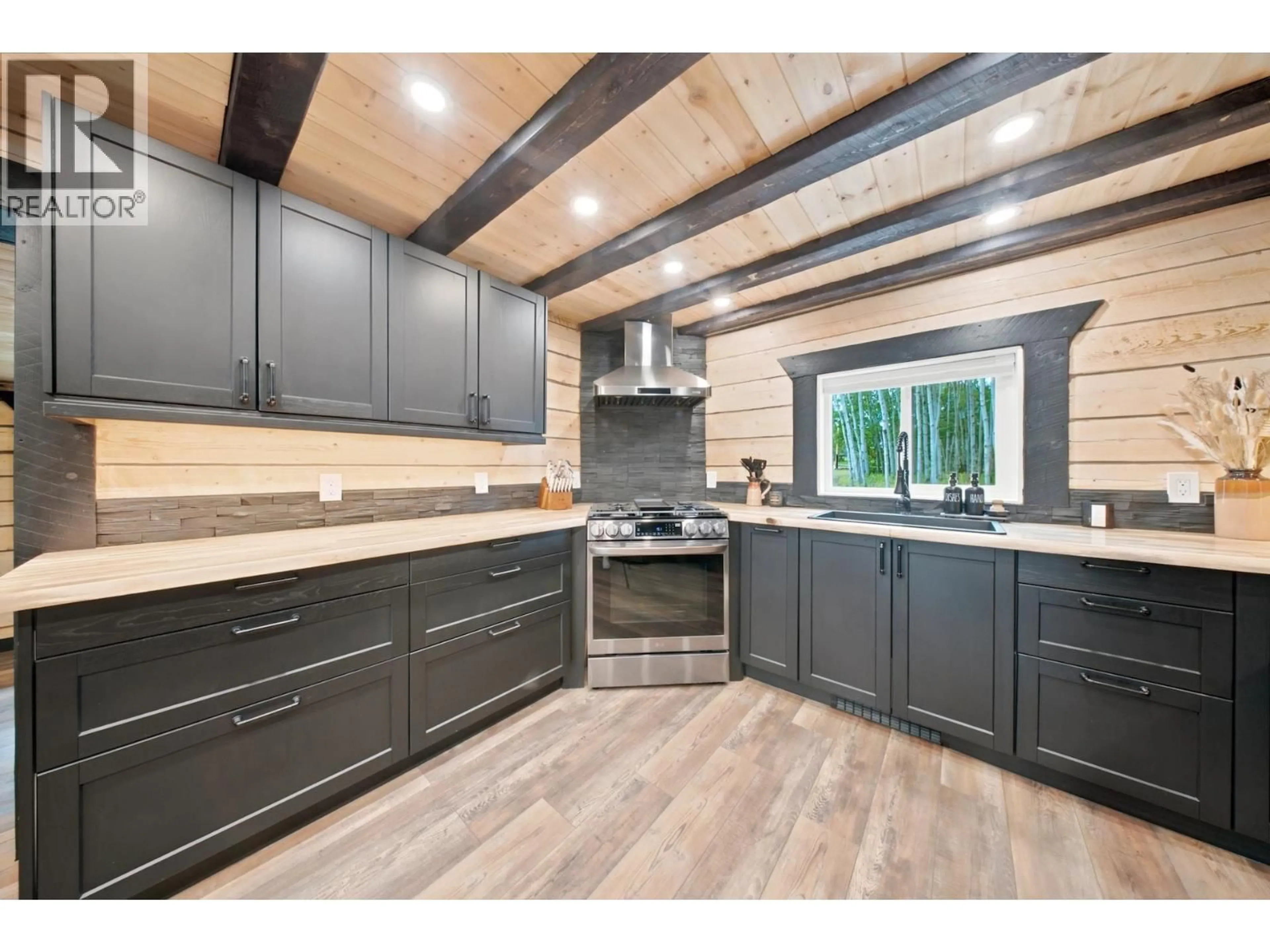 Open concept kitchen, wood/laminate floor for 14452 WELCH SUBDIVISION ROAD, Fort St. John British Columbia V1J8L6