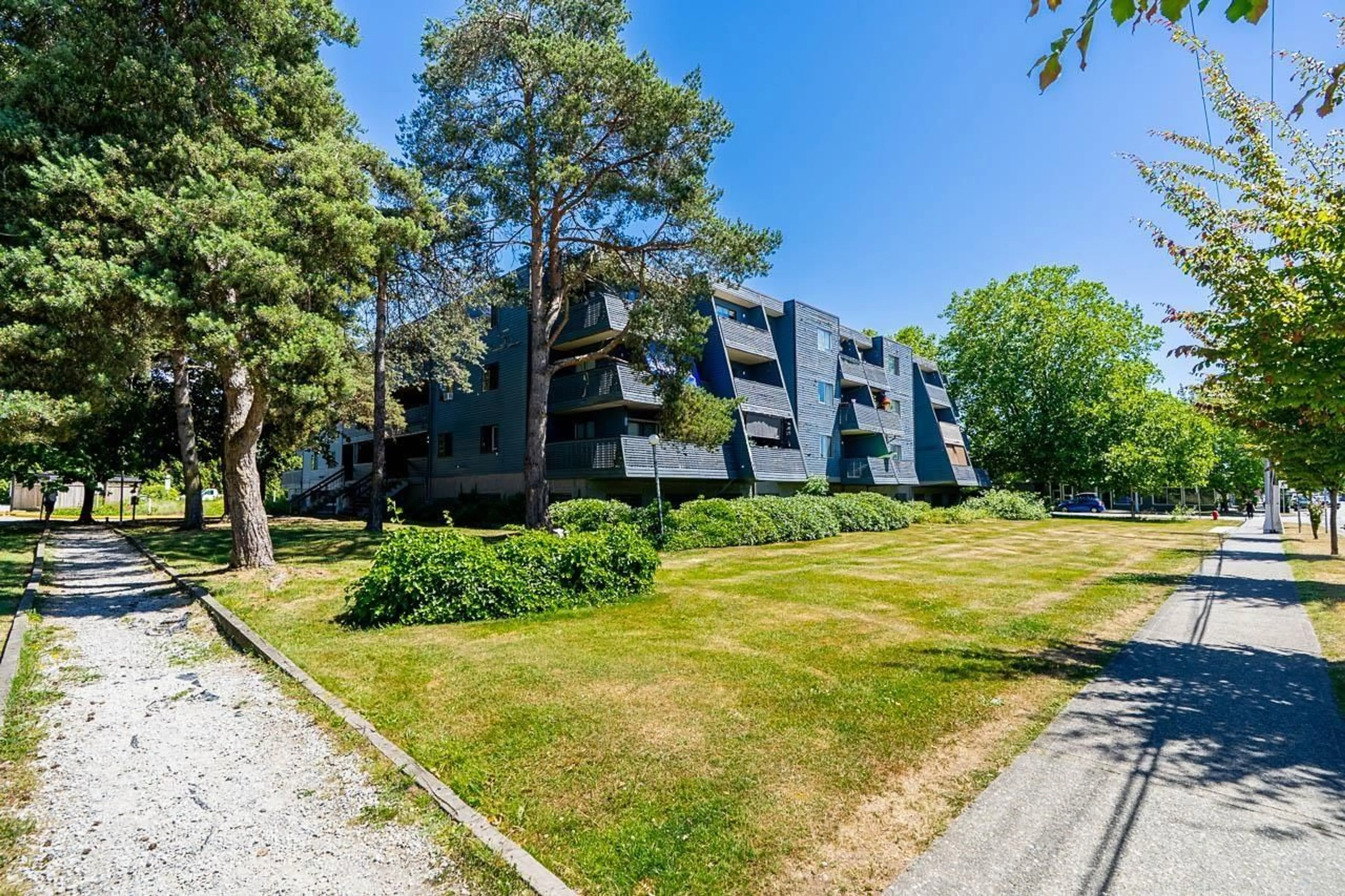 A pic from outside/outdoor area/front of a property/back of a property/a pic from drone, forest/trees view for 207 - 17661 58A AVENUE, Surrey British Columbia V3S1N4